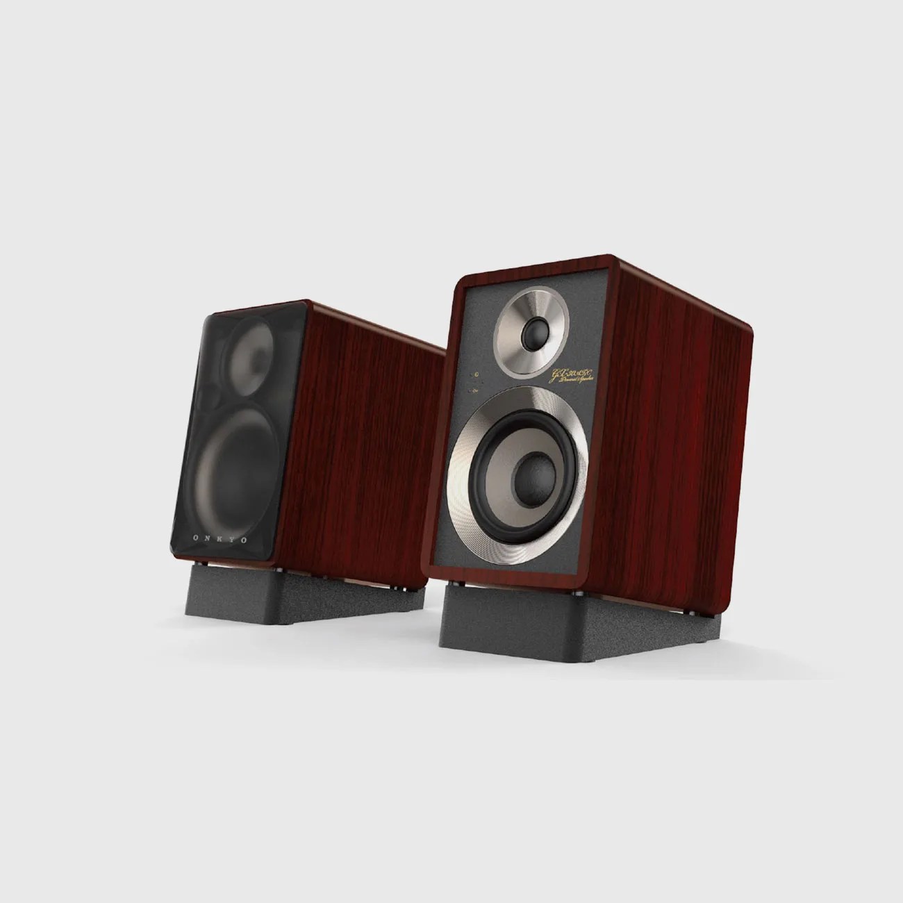 Pair of compact bookshelf speakers with dark wood finish and black speaker stands on a white background.