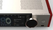 Silver Onkyo integrated amplifier with black digital display, large volume knob, and red wood side panels.