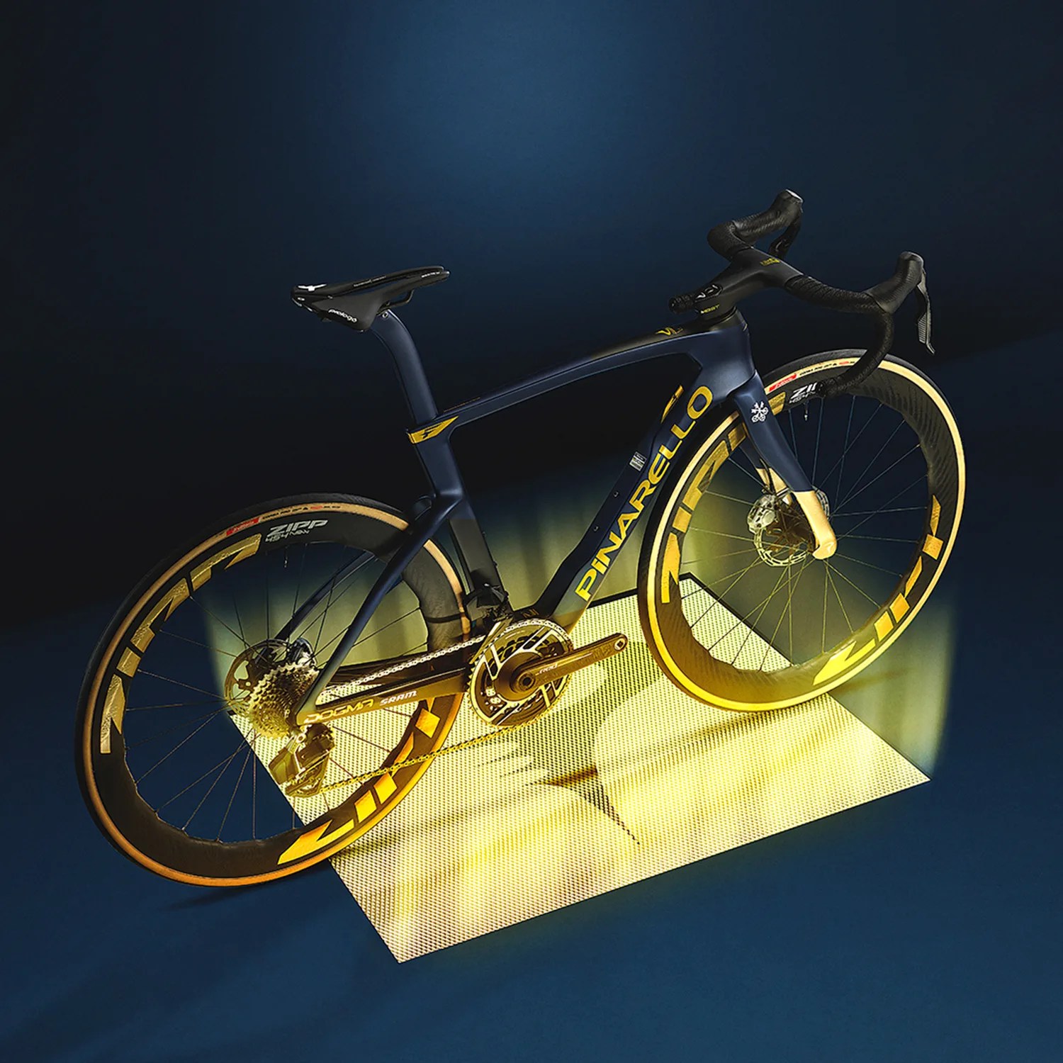 Matte navy blue Pinarello road bike with yellow branding and deep-section Zipp wheels on a dark background.