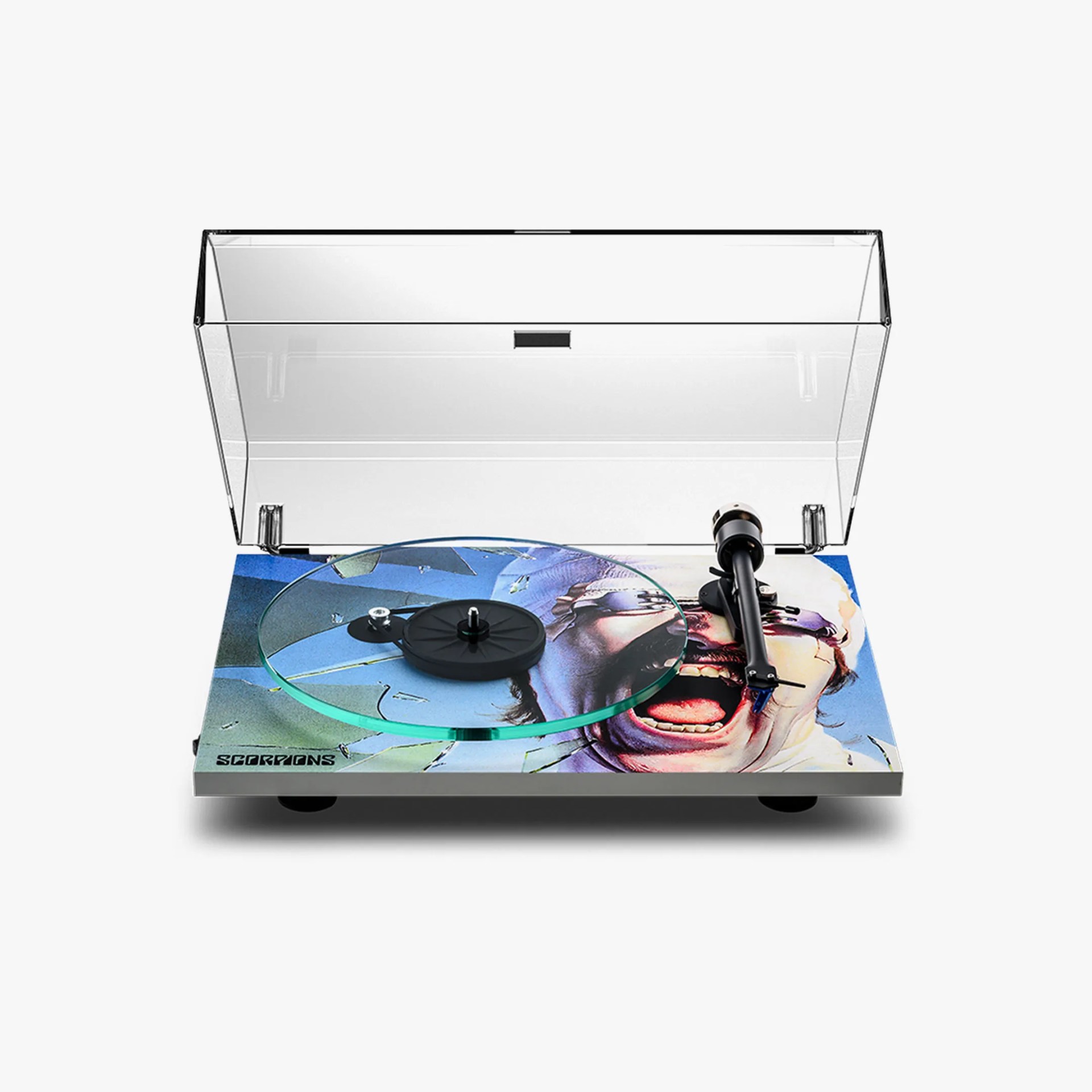 Turntable with a clear dust cover and a colorful base featuring a screaming face and the word 