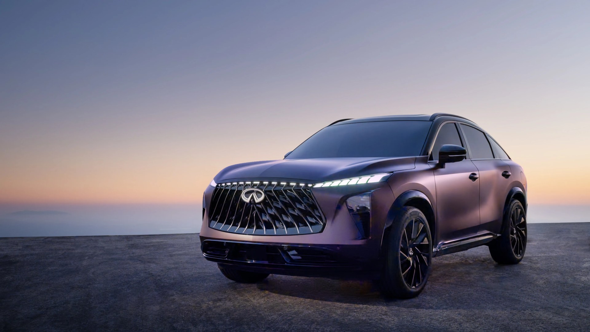 Purple Infiniti SUV with black grille and wheels parked on a flat surface at sunset.