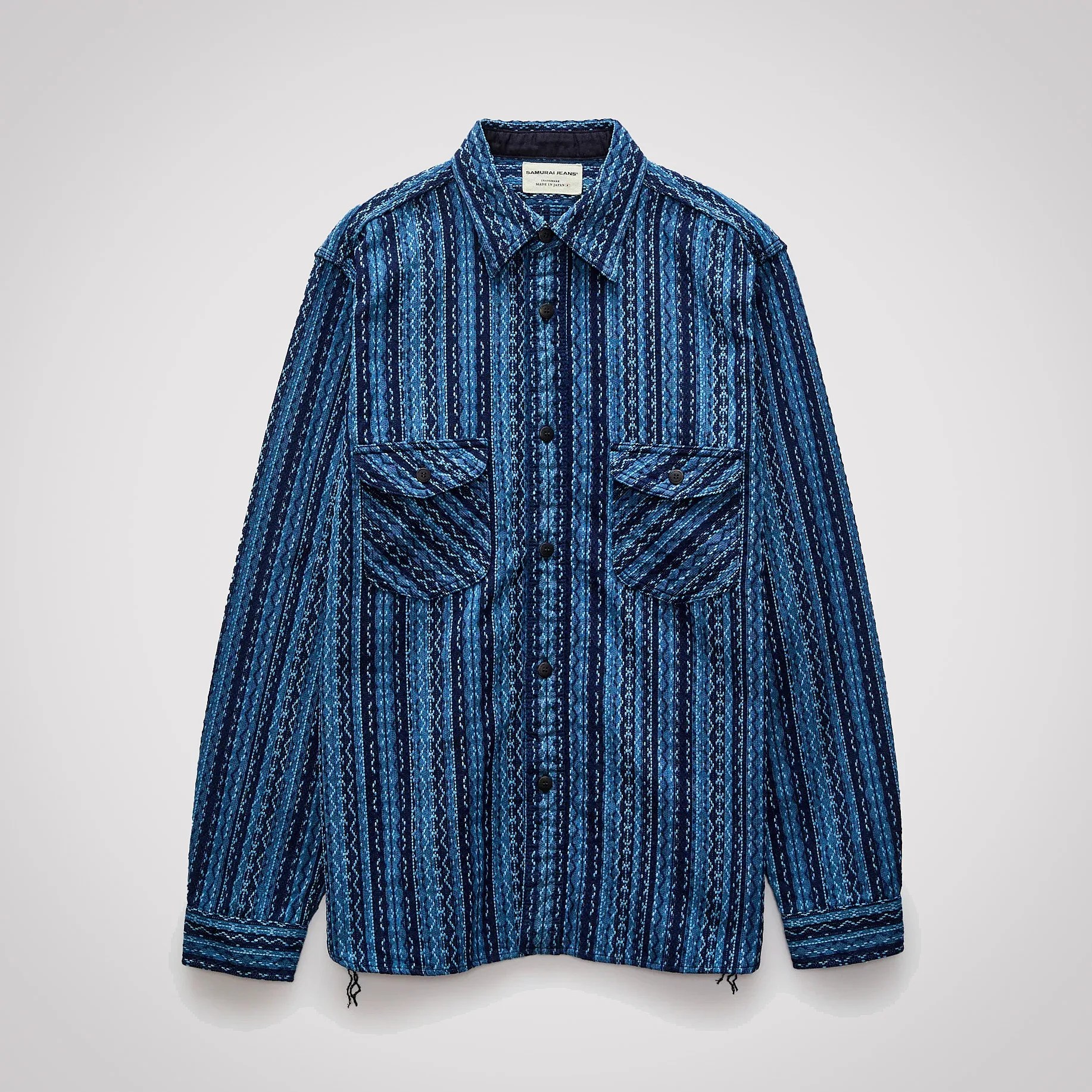 Blue patterned long-sleeve button-up shirt with two front flap pockets.