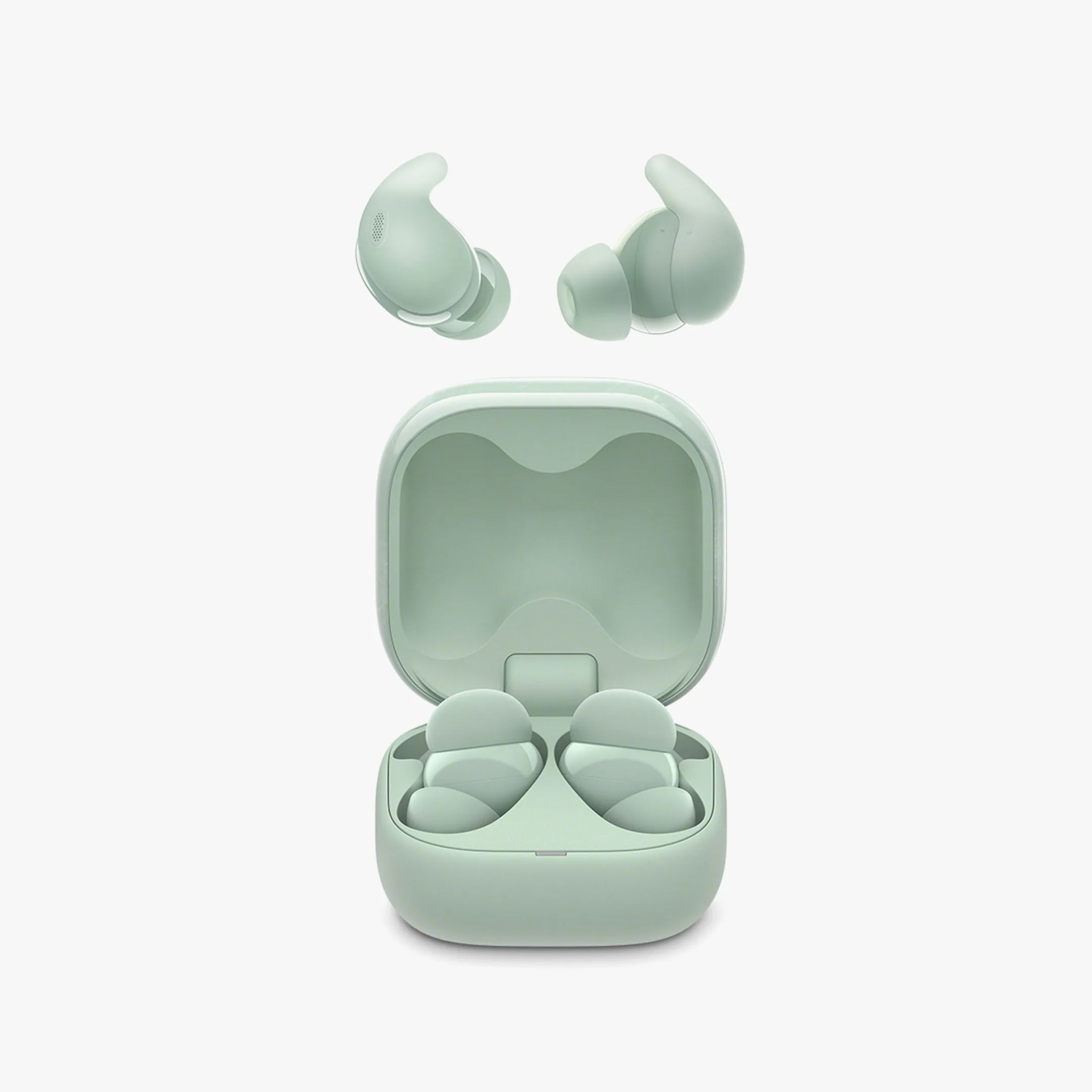 Pair of light green wireless earbuds with silicone ear tips and matching open charging case.