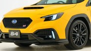 Front view of a yellow Subaru WRX S4 with black grille, LED headlights, and black alloy wheels.