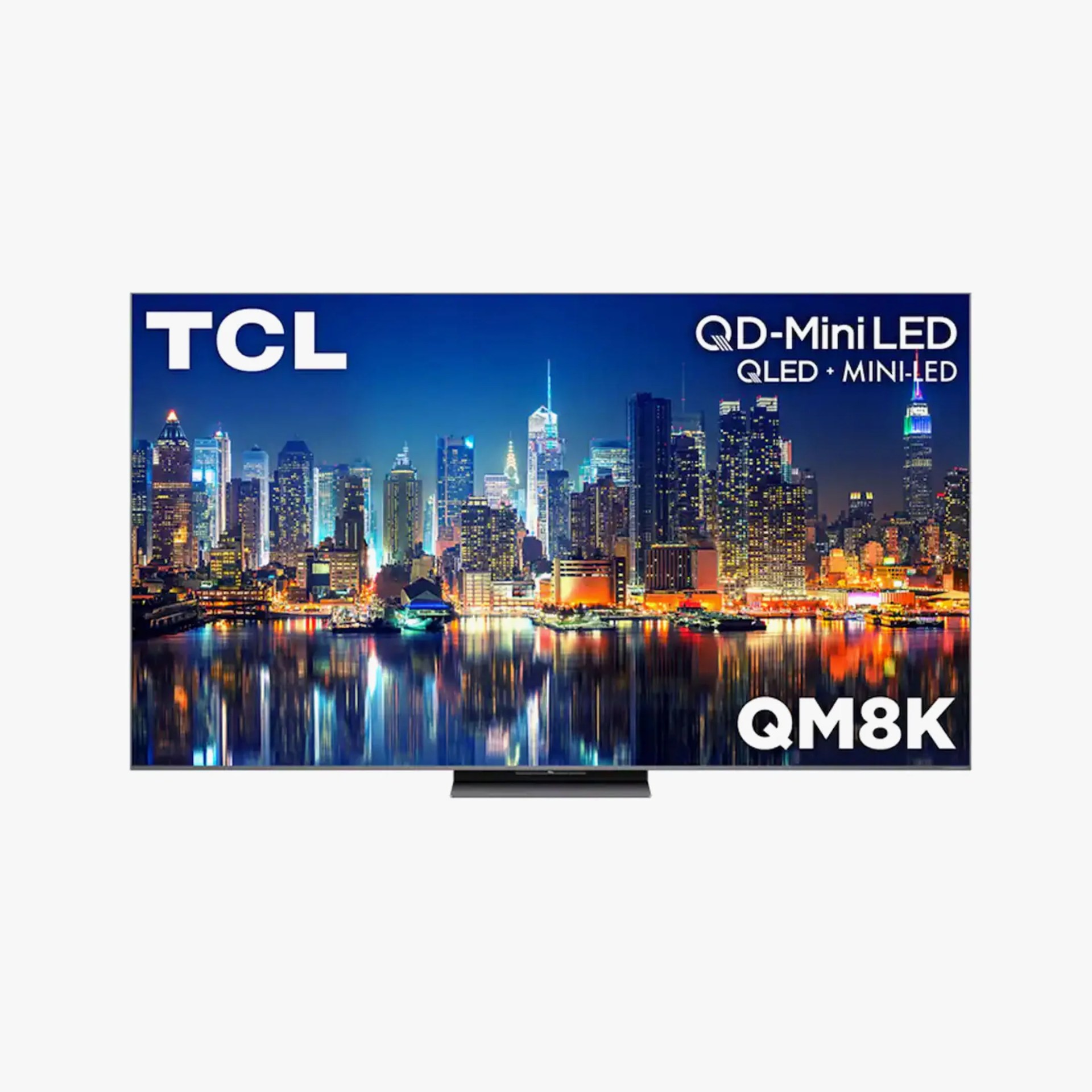 TCL QM8K QD-Mini LED QLED TV displaying a vibrant city skyline at night.
