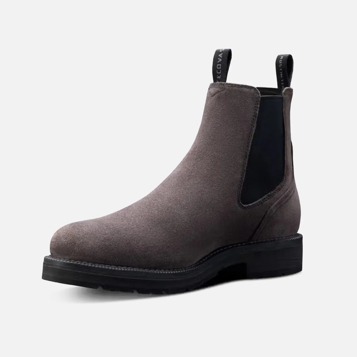 Gray suede Chelsea boot with black elastic side panels and black sole.
