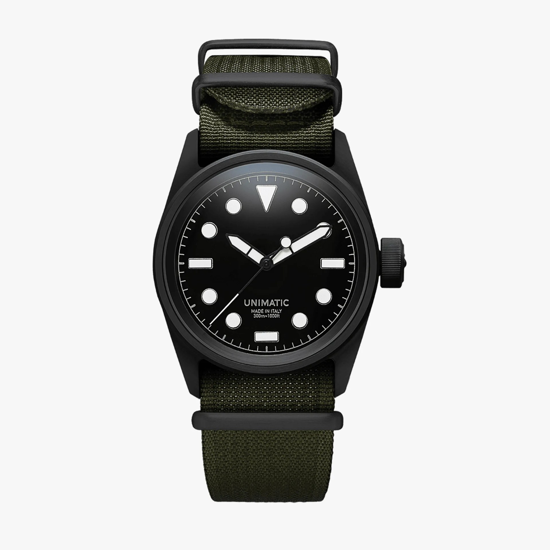 Black Unimatic wristwatch with white markers and hands, olive green fabric strap, and black buckle.