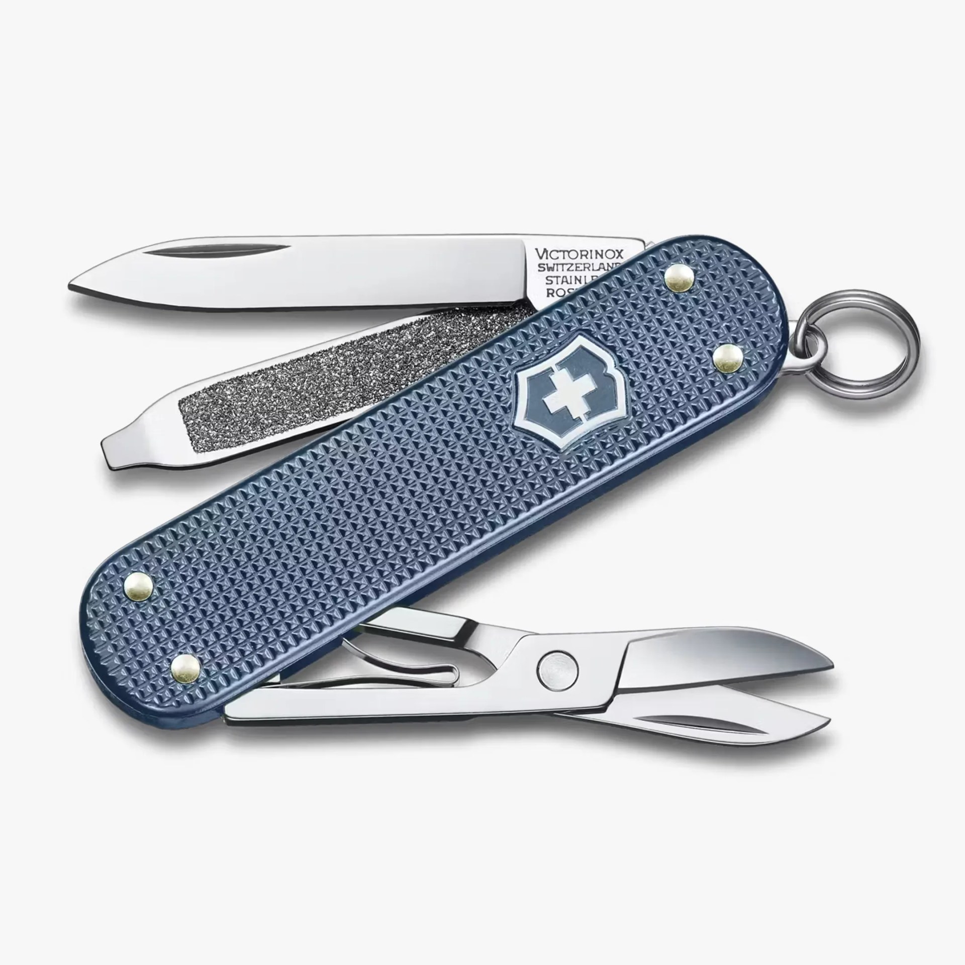 Blue textured Swiss Army knife with a small blade, nail file, and scissors partially open.
