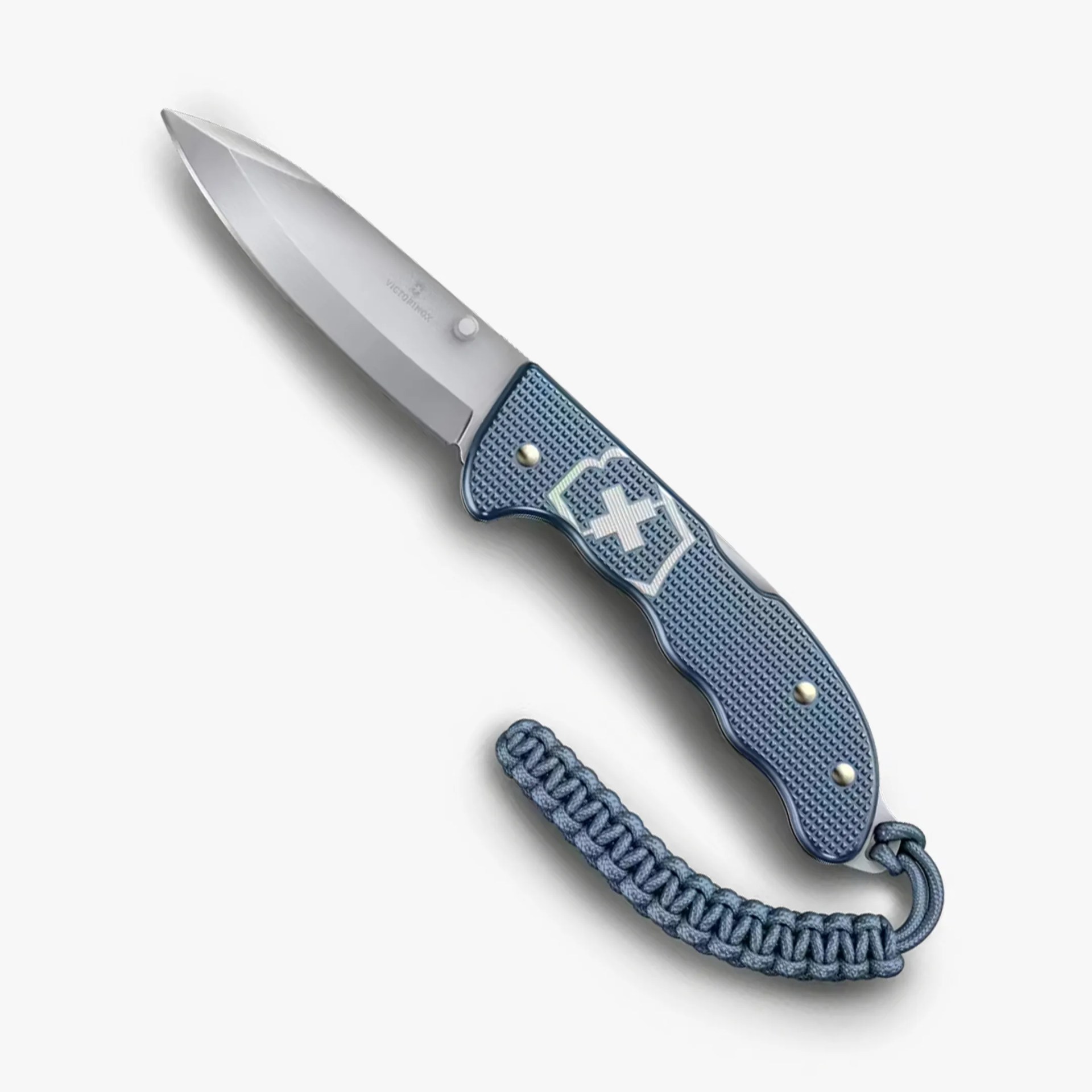 Folding knife with a silver blade and textured blue handle featuring a white cross emblem and a braided blue lanyard.