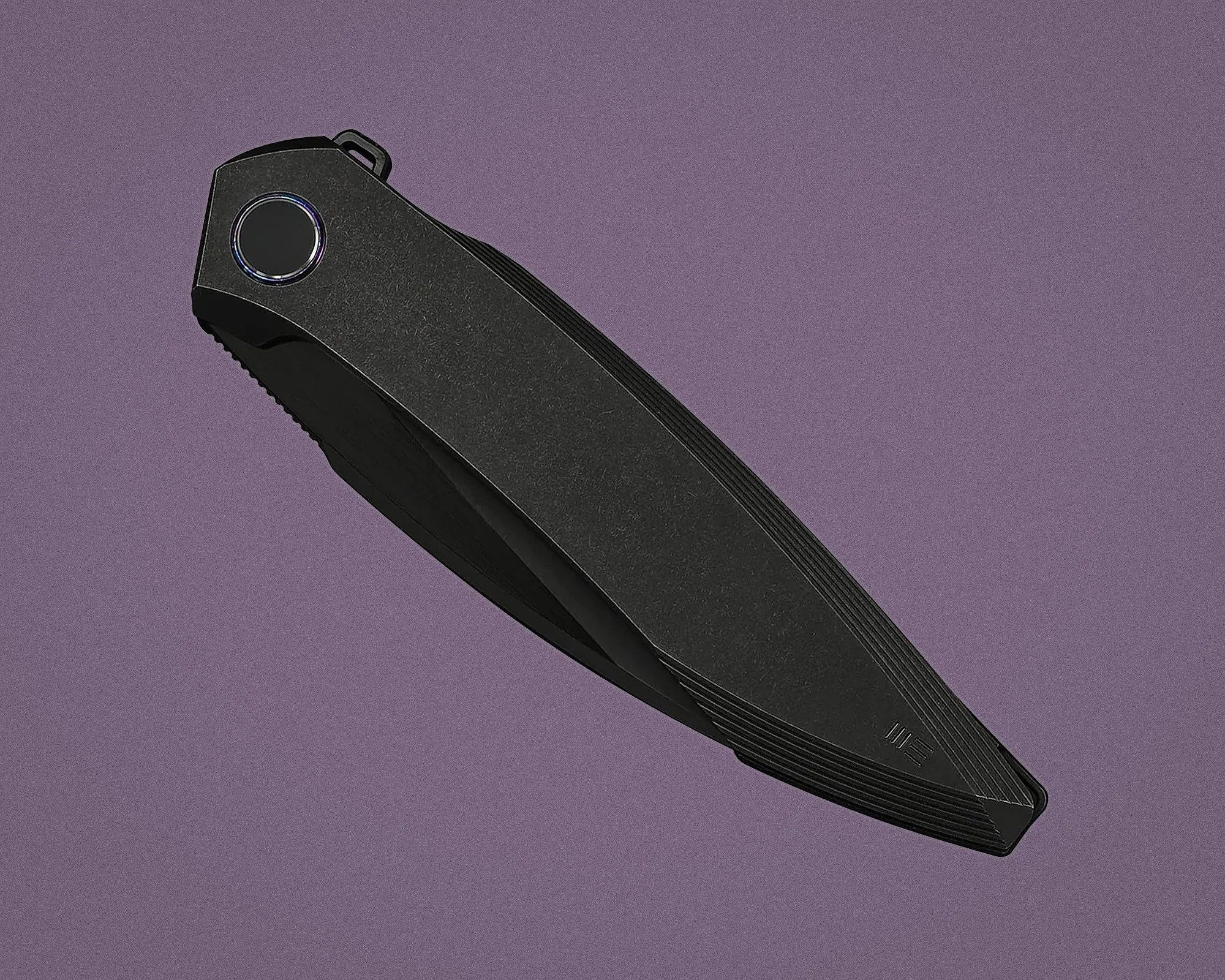 Black folding pocket knife with textured handle and circular pivot on a purple background.
