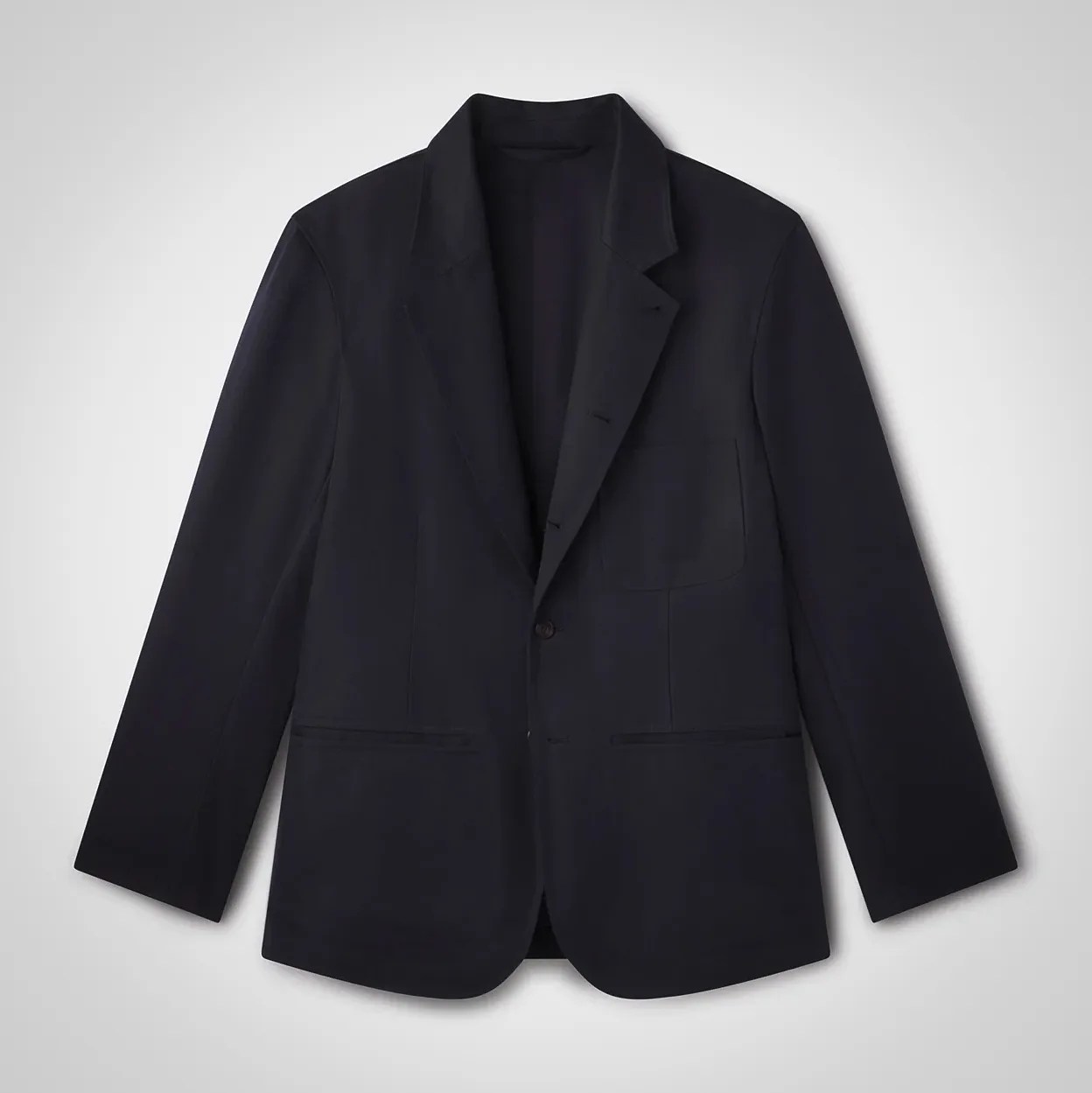 Black single-button blazer with notch lapels and patch pockets laid flat on a white background.