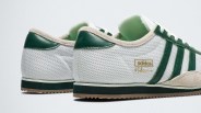 Pair of white Adidas sneakers with green stripes, beige suede trim, and gold logo detail.