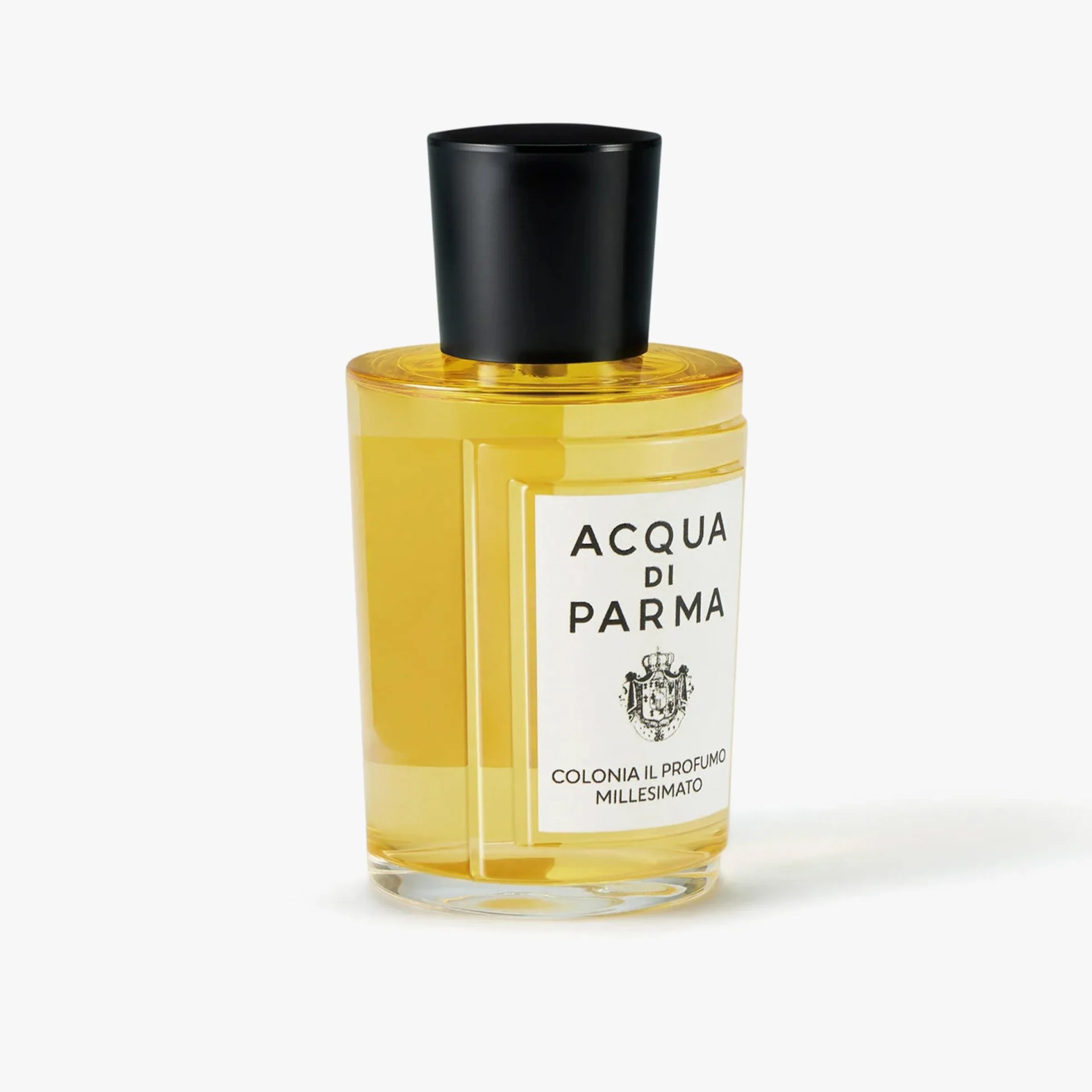 Clear cylindrical glass bottle with yellow liquid and black cap labeled "Acqua di Parma Colonia Il Profumo Millesimato.