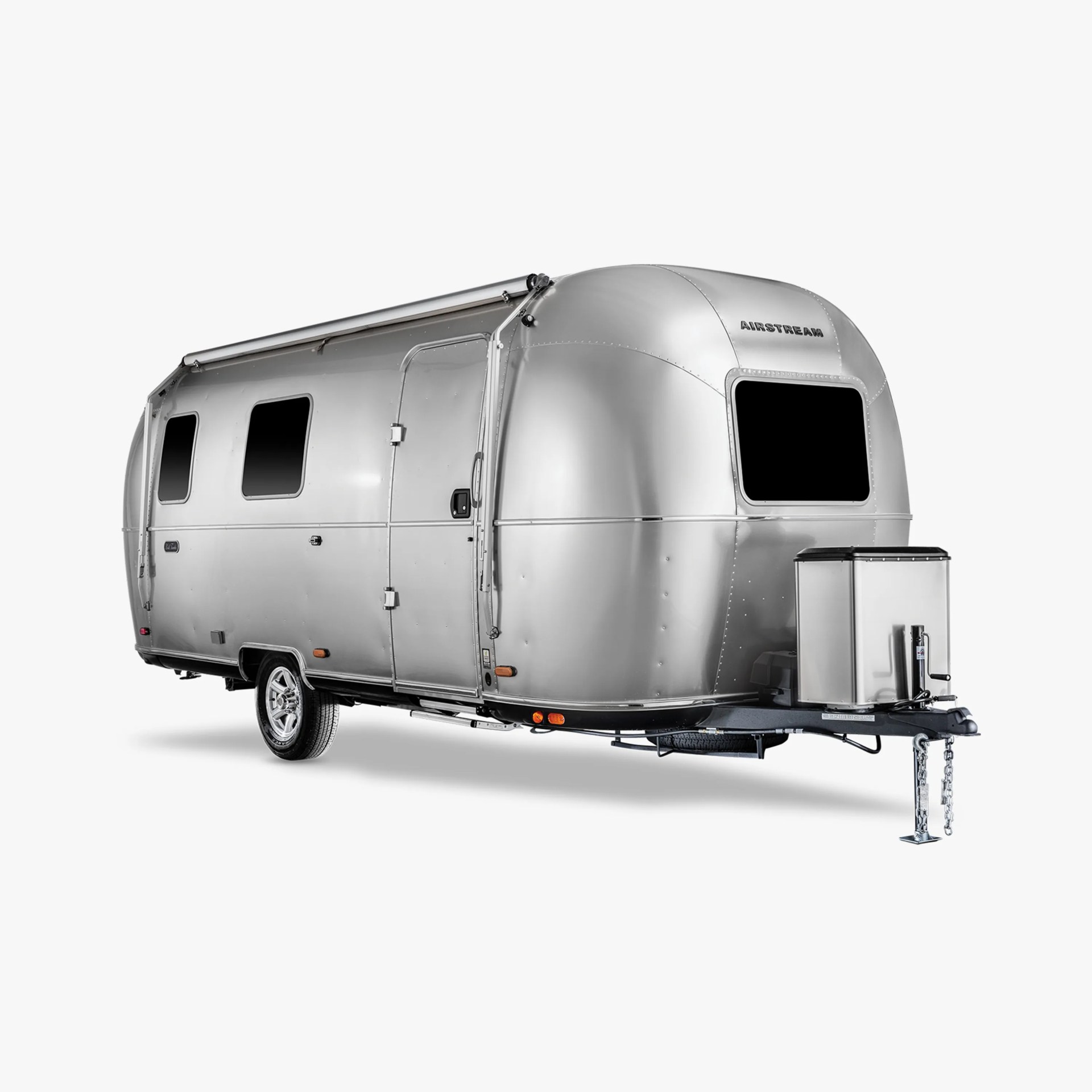Silver Airstream travel trailer with rounded front and three dark windows on a white background.