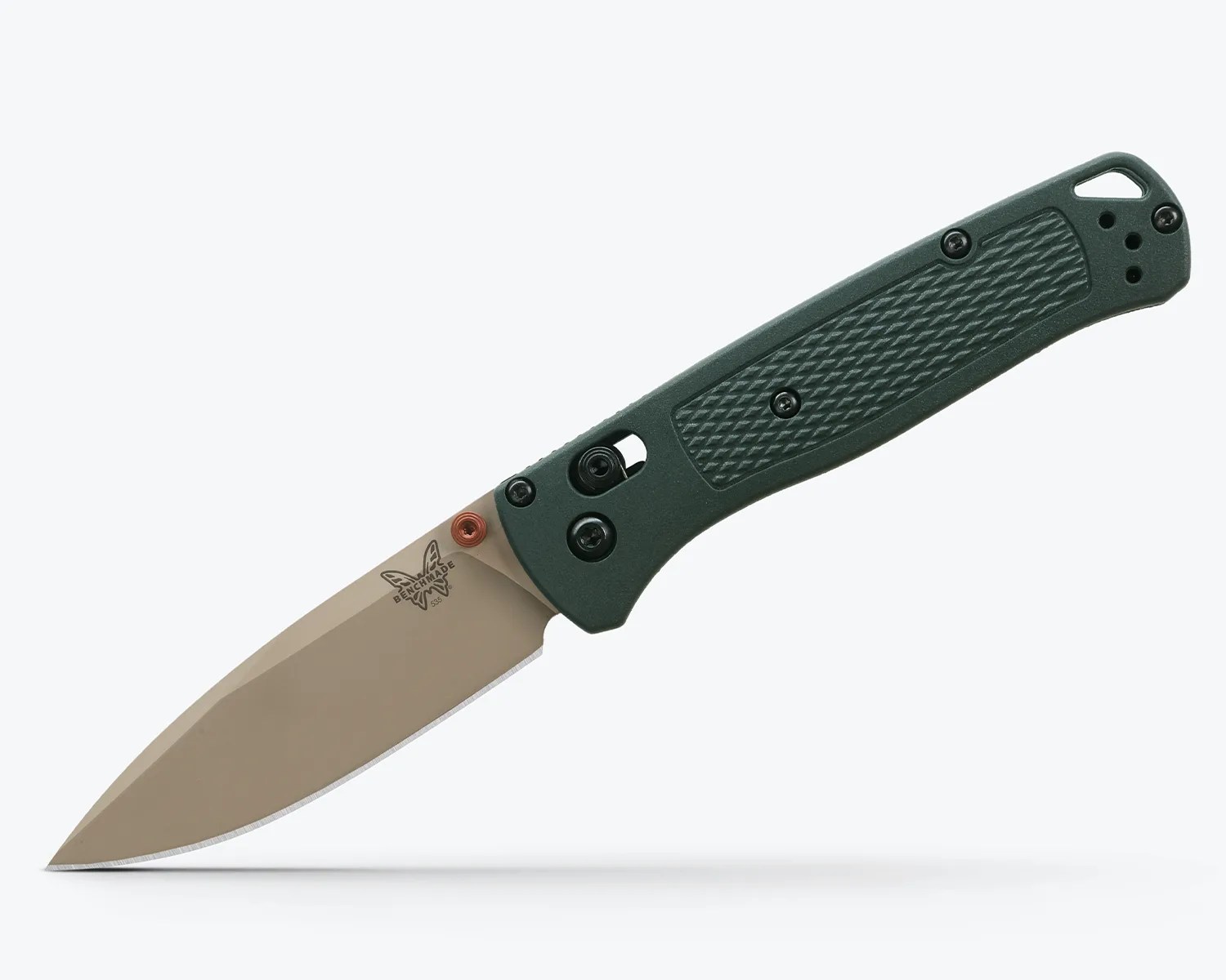 Folding knife with tan blade and textured dark green handle, Benchmade logo near blade base.