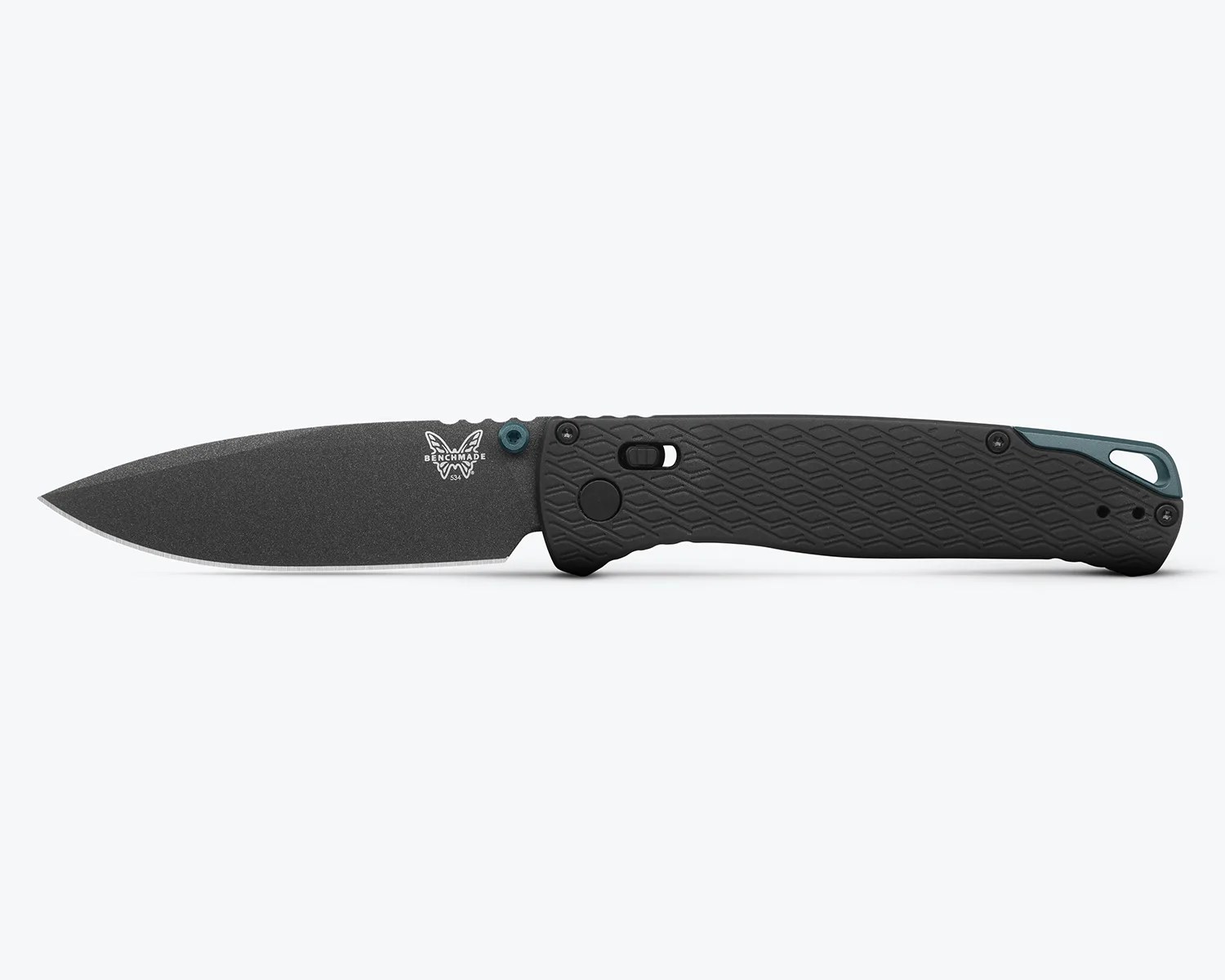 Black Benchmade folding knife with textured handle and partially serrated blade on white background.