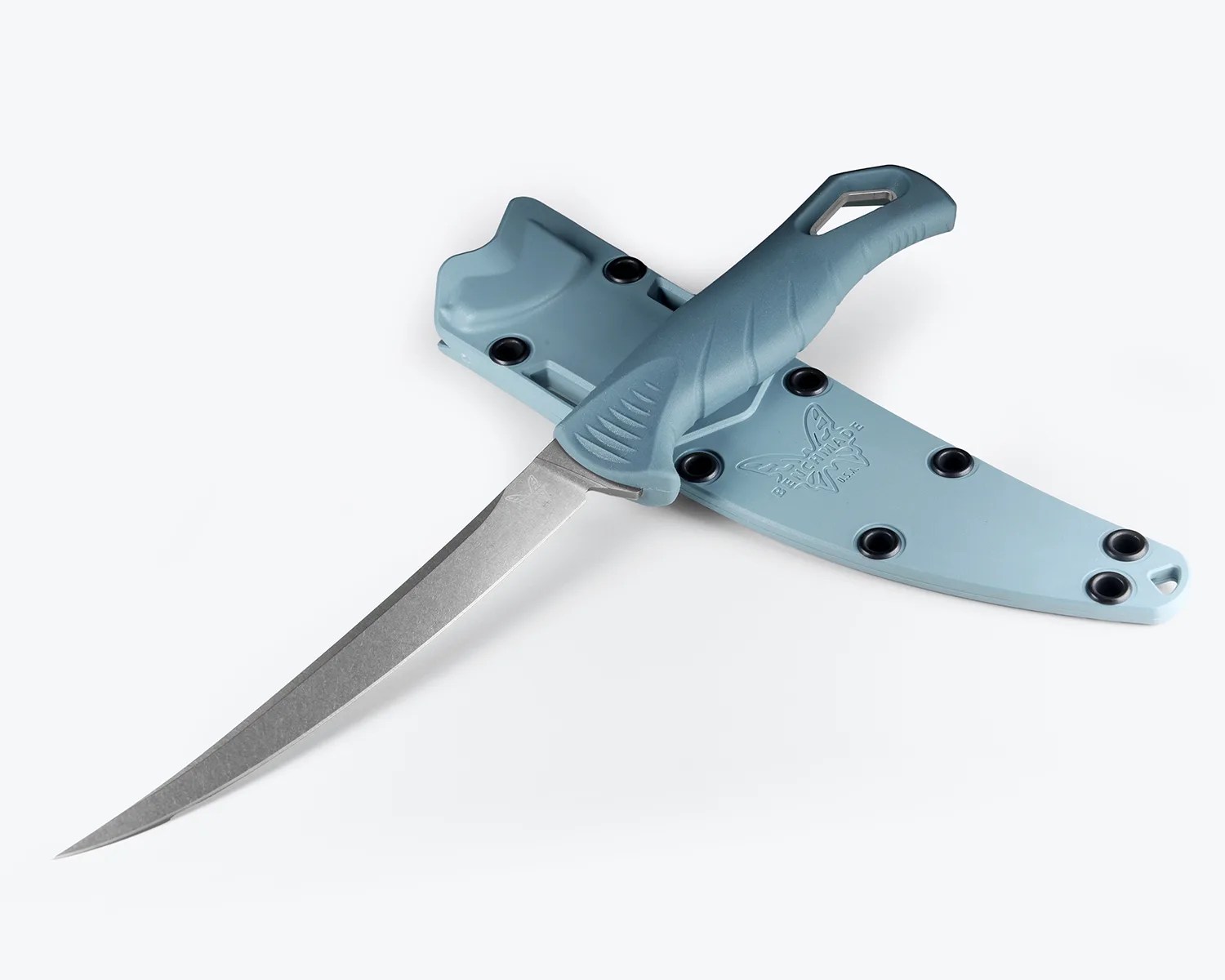 Curved fillet knife with a textured blue handle resting on a matching blue sheath with black rivets.