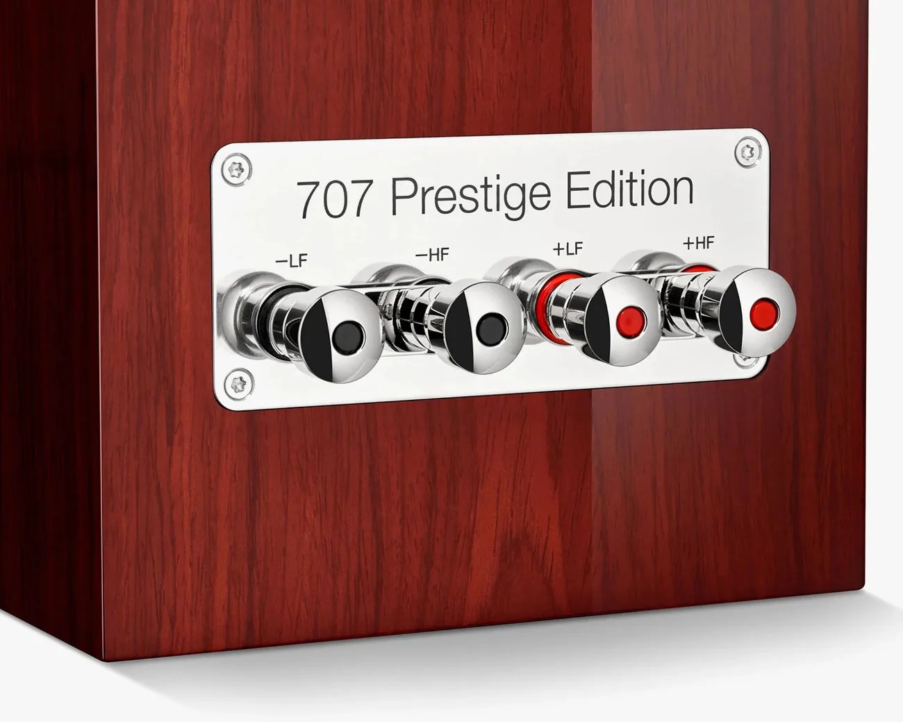 Close-up of a wooden speaker terminal panel labeled "707 Prestige Edition" with four chrome binding posts marked -LF, -HF, +LF, and +HF.
