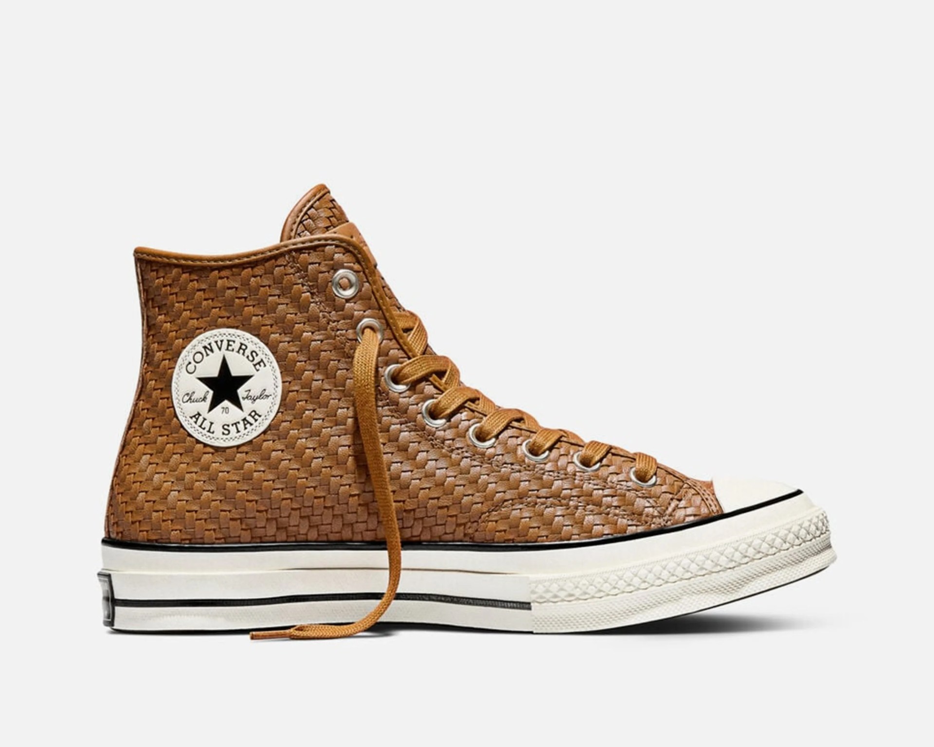 Brown woven leather Converse Chuck Taylor All Star high-top sneaker with white rubber sole and black stripe.