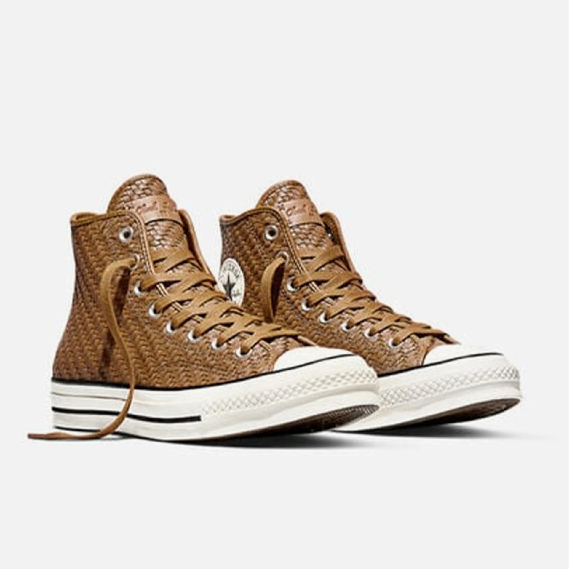 Pair of brown woven high-top sneakers with white rubber soles and laces.