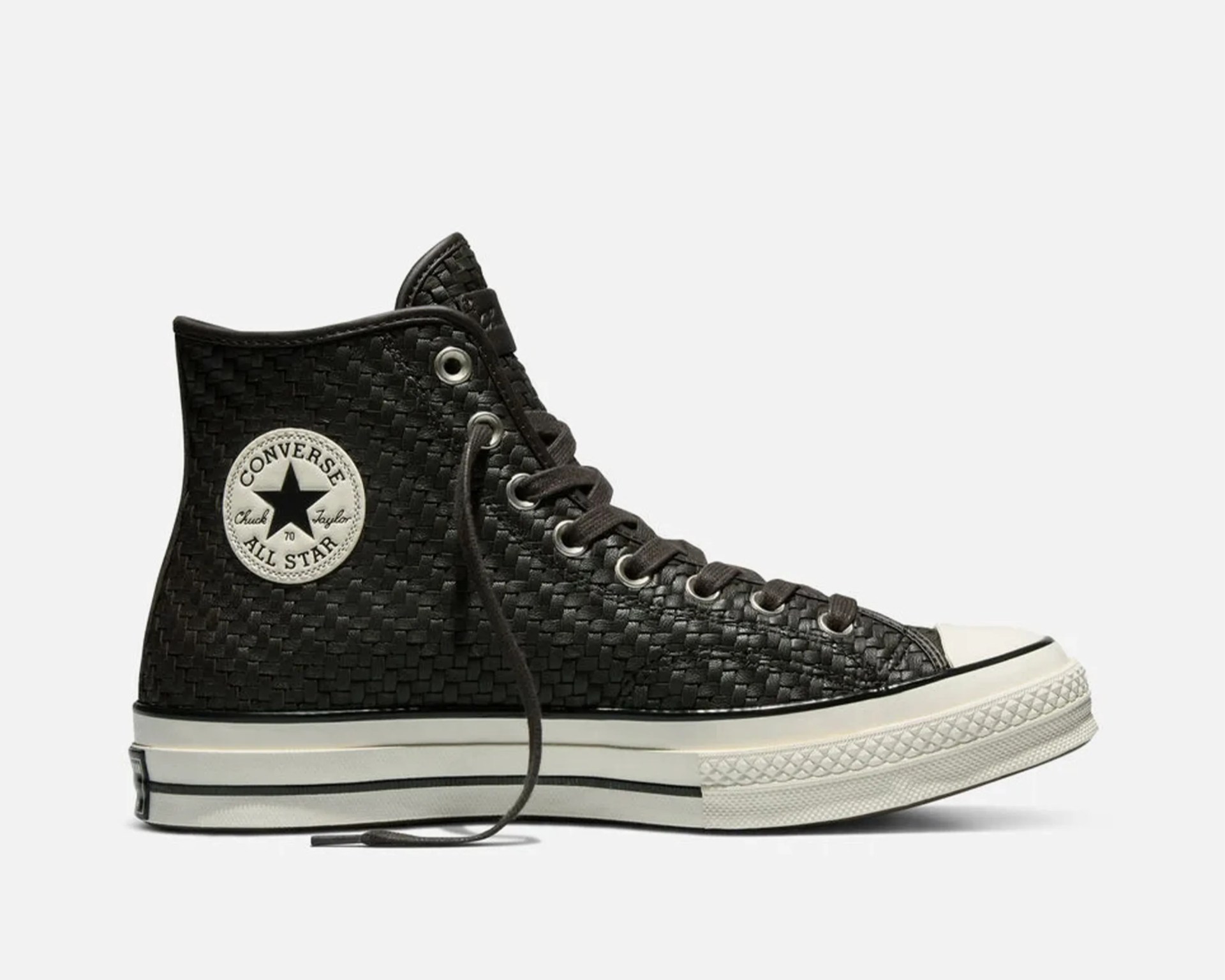 Black woven high-top Converse Chuck Taylor All Star sneaker with white rubber sole and toe cap.