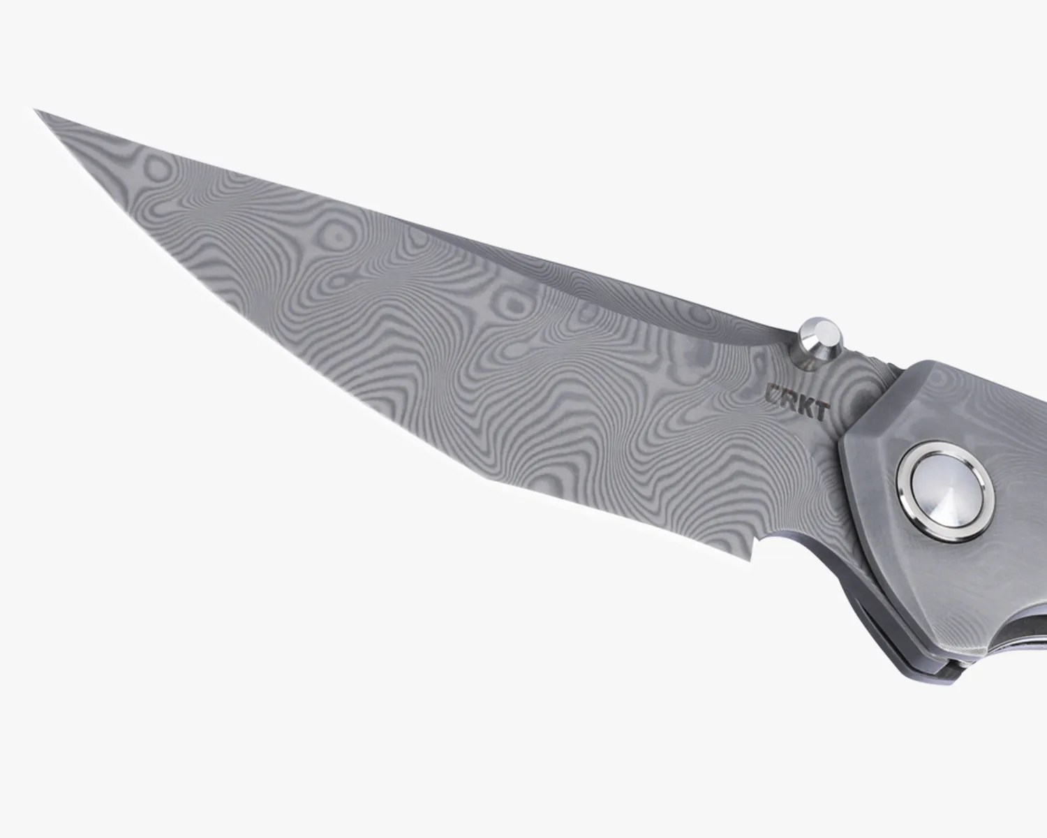 Close-up of a folding knife blade with a gray Damascus steel pattern and a thumb stud near the handle.