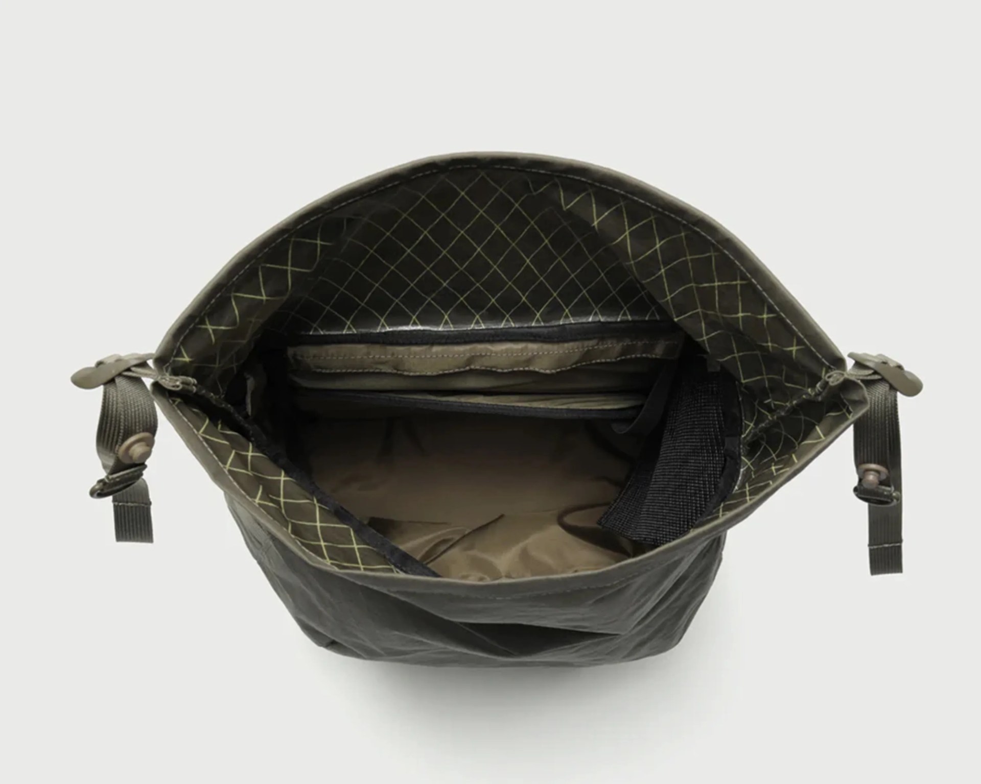 Top view of an open olive green bag with a grid-patterned interior and multiple inner pockets.
