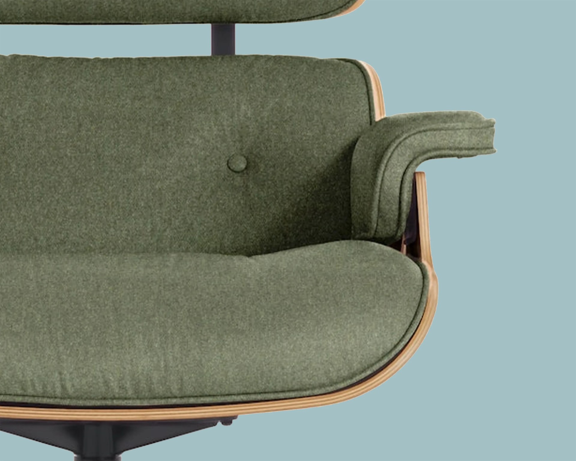 Green upholstered chair seat and armrest with wooden frame and black metal base against a blue background.