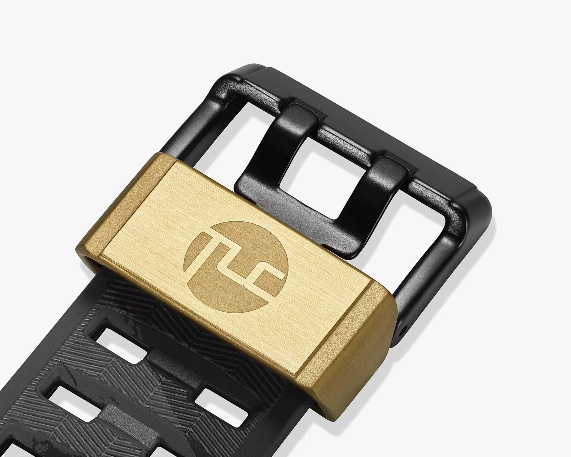 Black and gold metal buckle attached to a black textured strap with a circular logo on the gold part.
