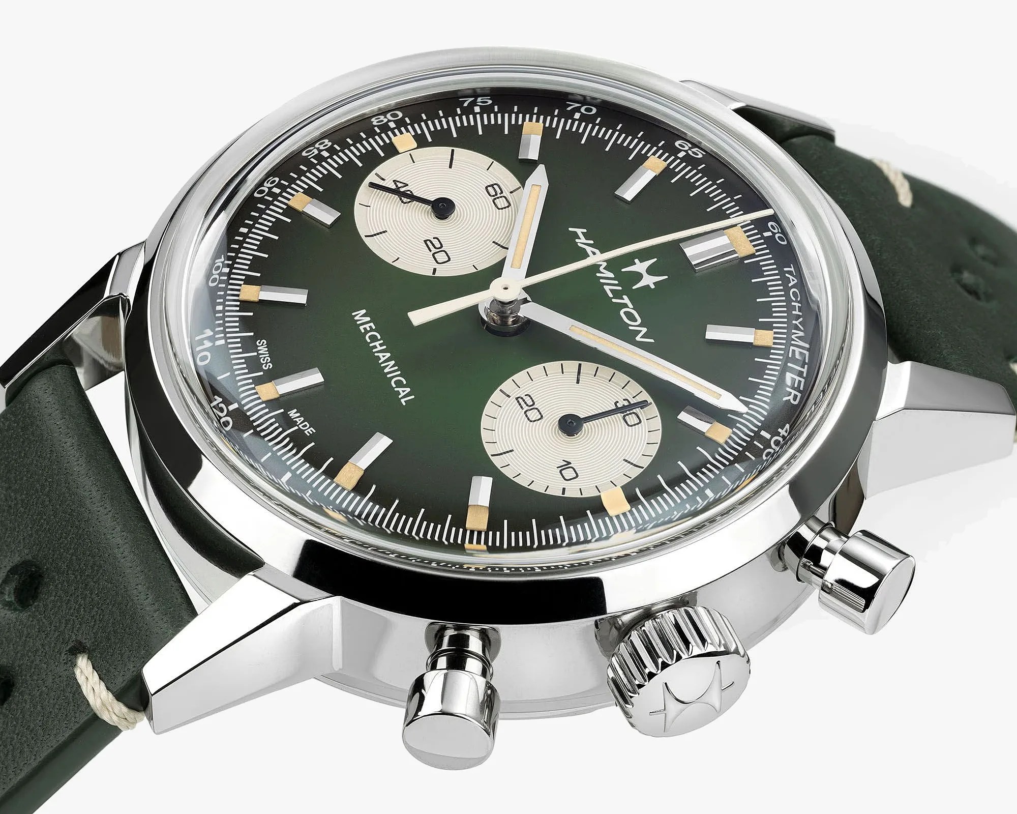 Close-up of a Hamilton mechanical chronograph watch with a green dial, silver subdials, and a green leather strap.