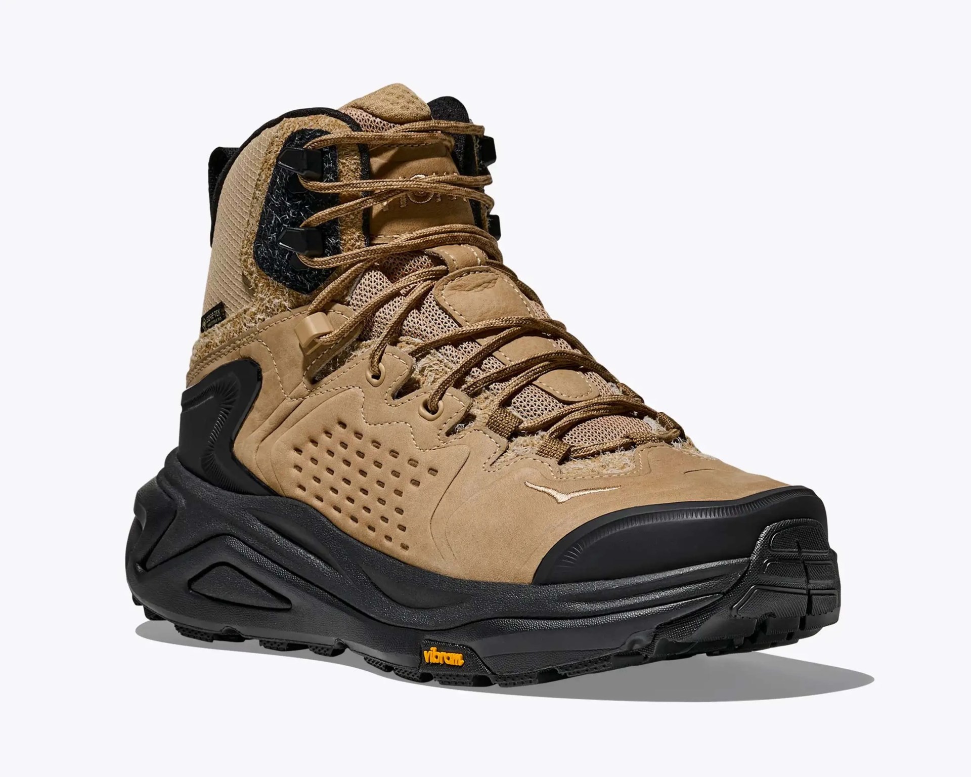 Tan and black hiking boot with Vibram sole and mesh fabric upper.
