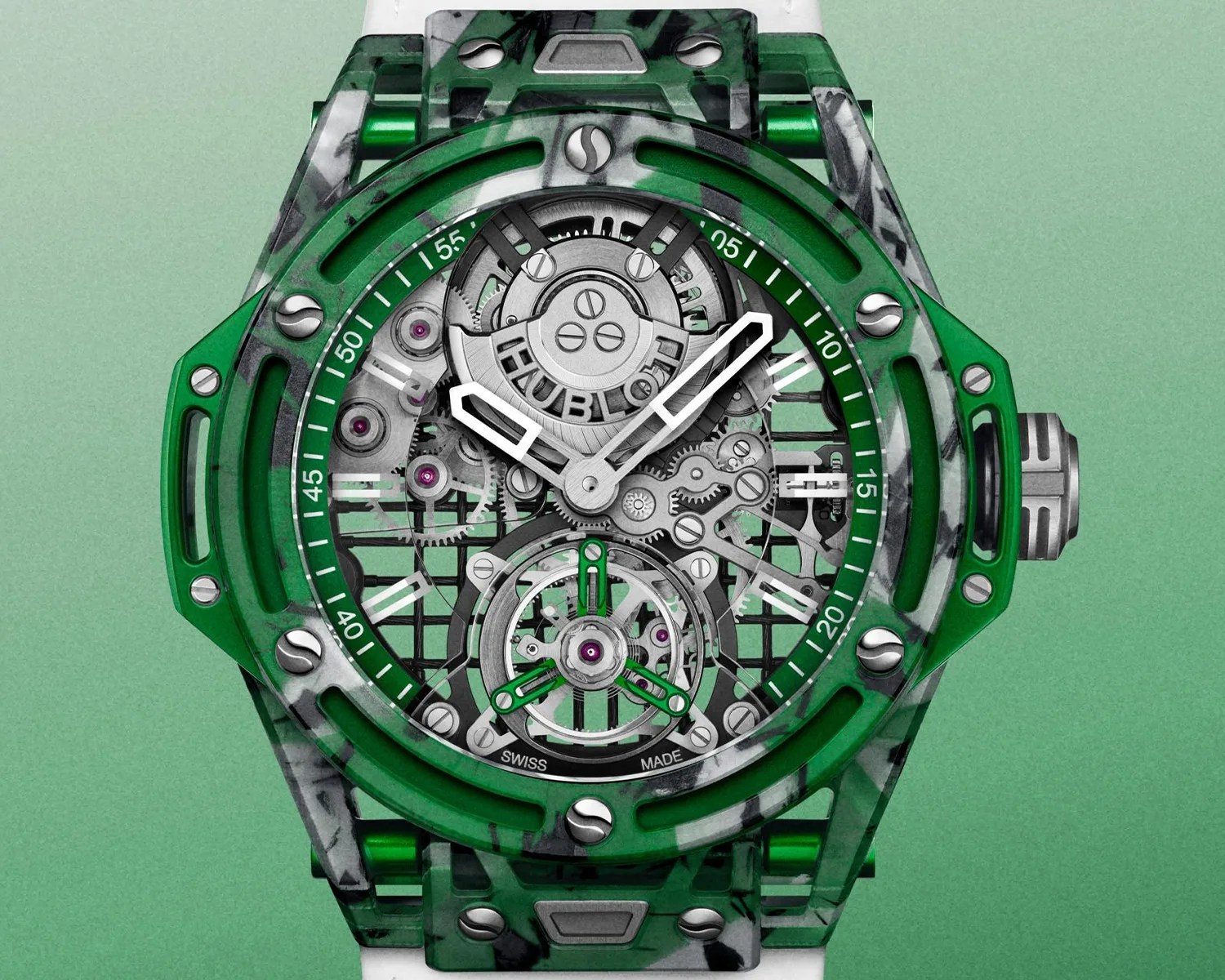 Green and black marbled Hublot wristwatch with visible mechanical gears and white hands on a green gradient background.