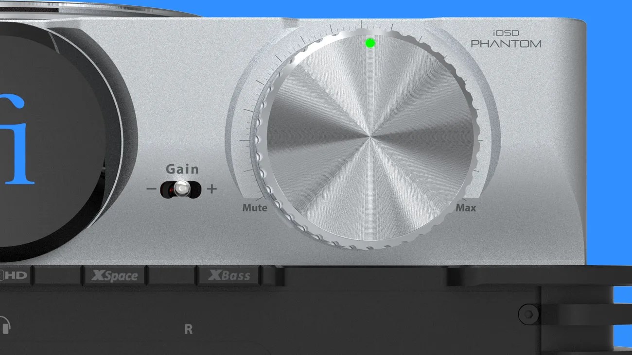 Close-up of a silver volume knob with a green indicator light on an iDSD Phantom audio device.
