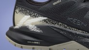 Close-up of black and beige KEEN waterproof shoe with textured sole and "KEEN ReGENX" and "KEEN TERRAIN SHIELD" text.