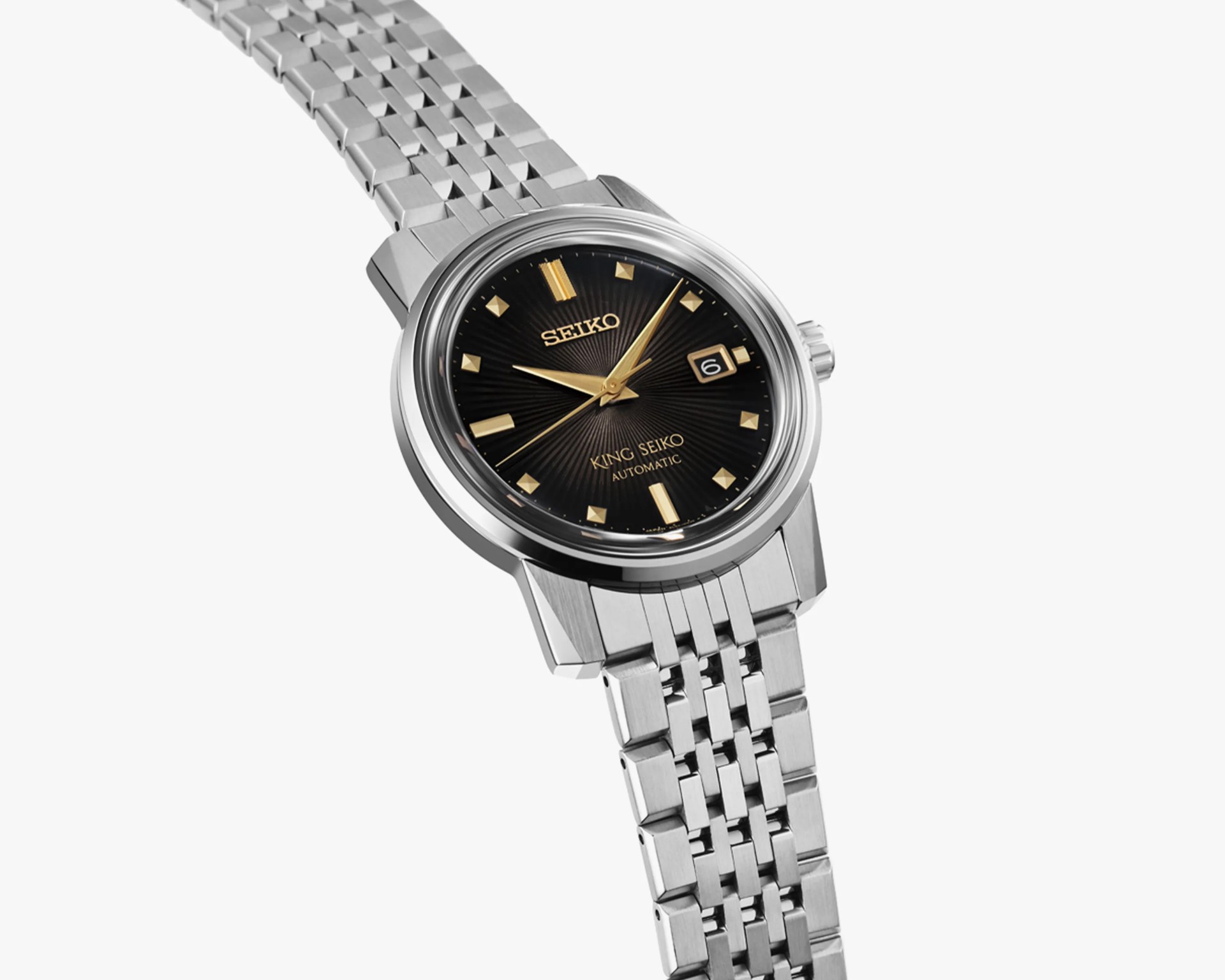Silver metal bracelet watch with black dial, gold hour markers, and date display at 3 o'clock.