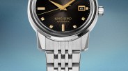 Close-up of a King Seiko automatic watch with a black dial, gold markers, and a stainless steel bracelet.