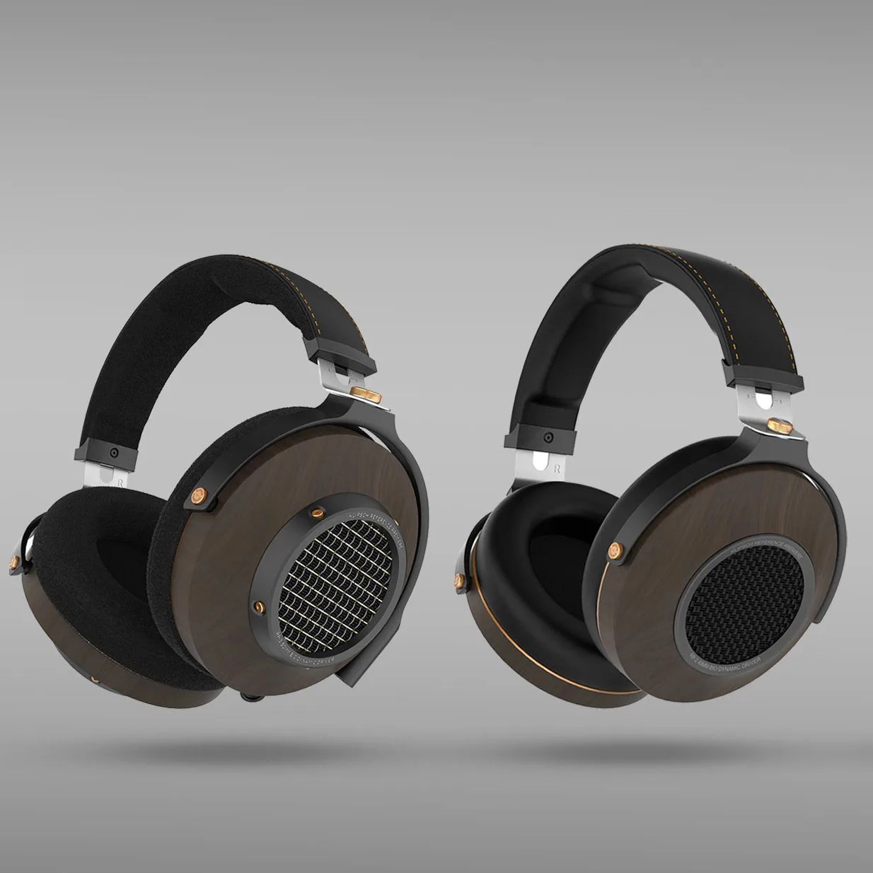 Pair of over-ear headphones with dark wood ear cups, black cushioned headband, and metal mesh grills.