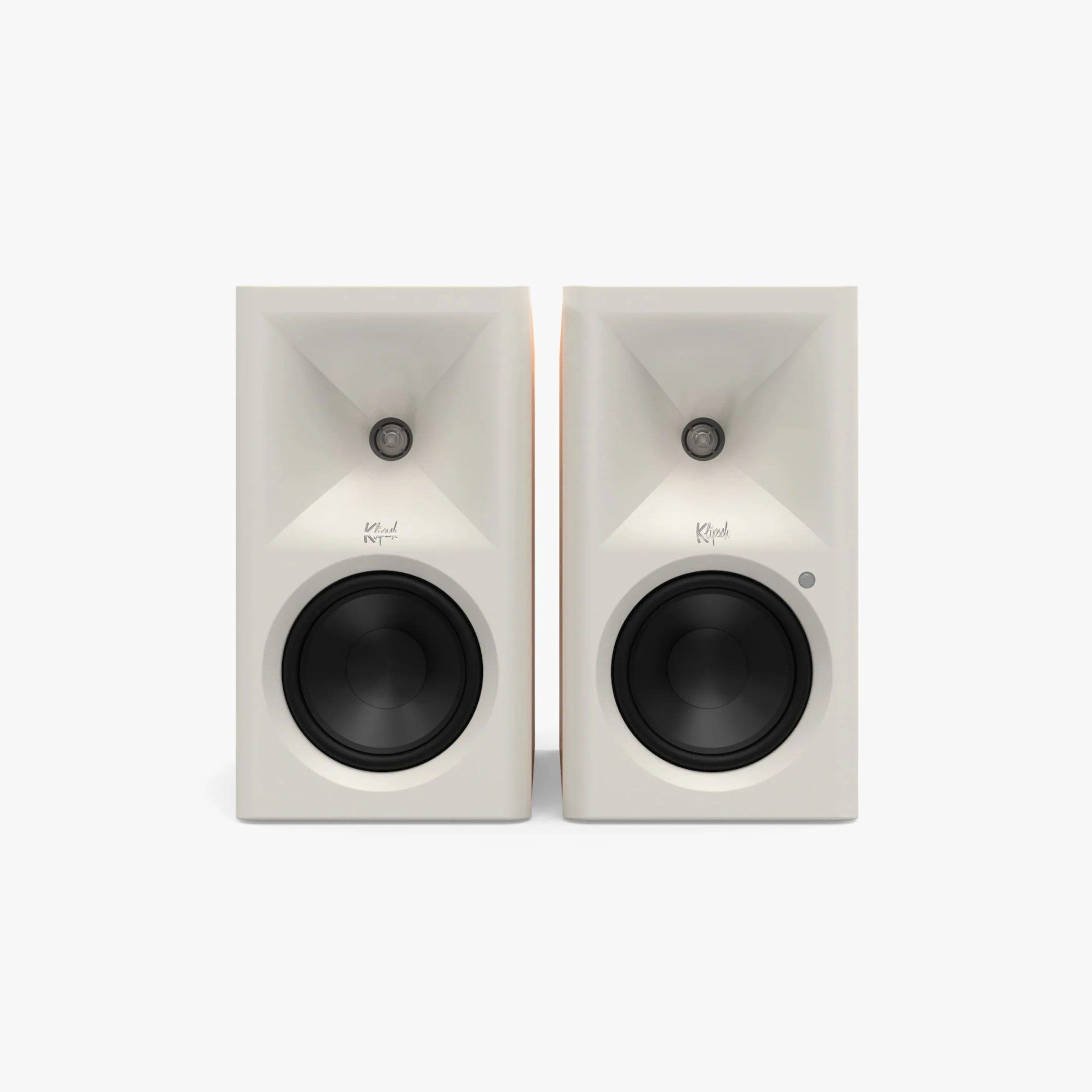 Pair of white Klipsch bookshelf speakers with black drivers and horn-loaded tweeters.