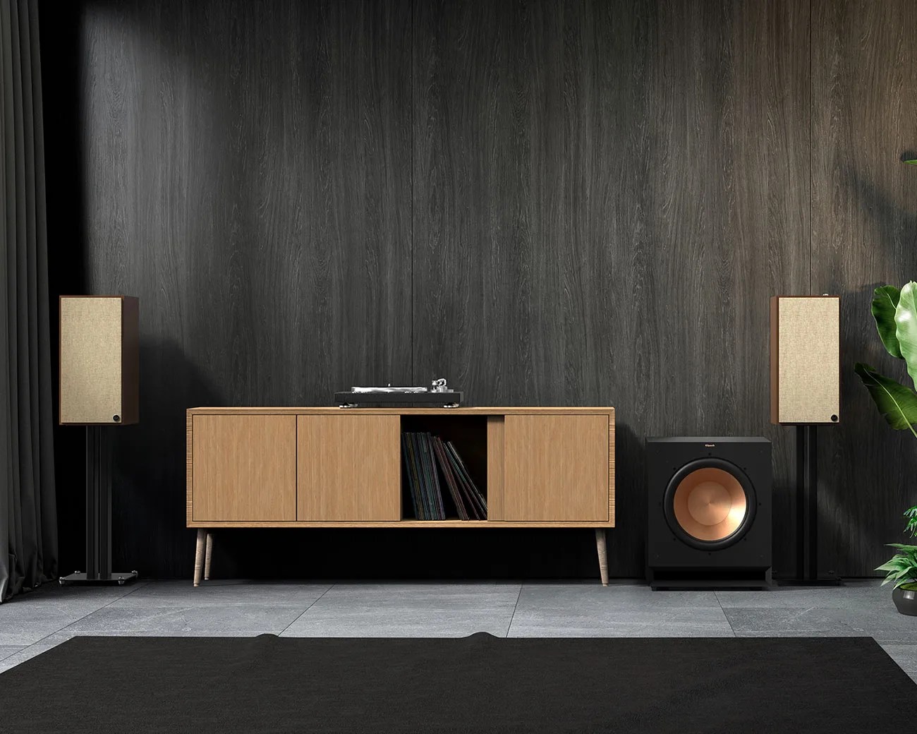 Modern audio setup with two beige fabric-covered speakers on black stands, a black subwoofer with copper cone, and a wooden cabinet with vinyl records.