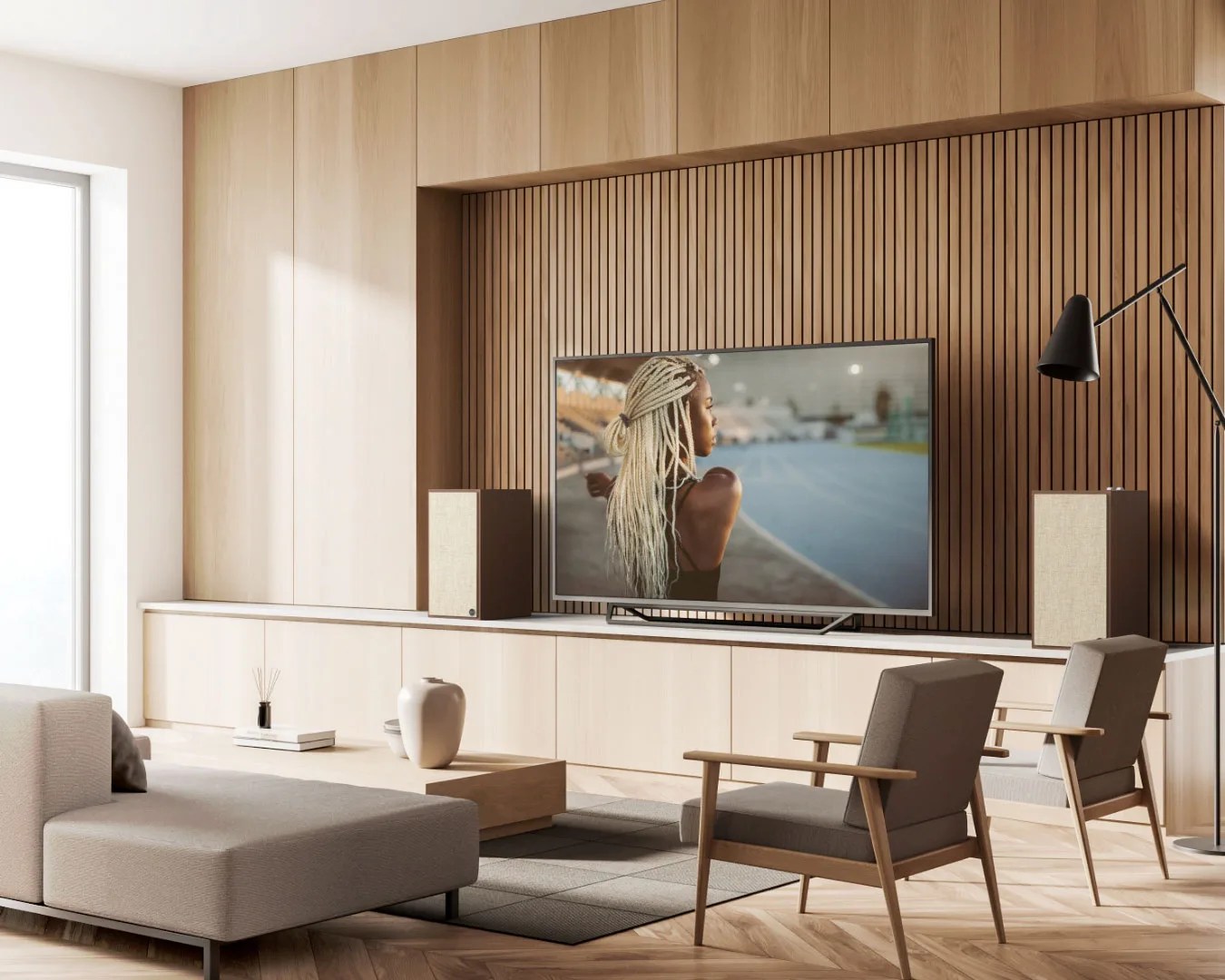 Modern living room with beige sectional sofa, two gray armchairs, wooden slat TV wall, and floor lamp.