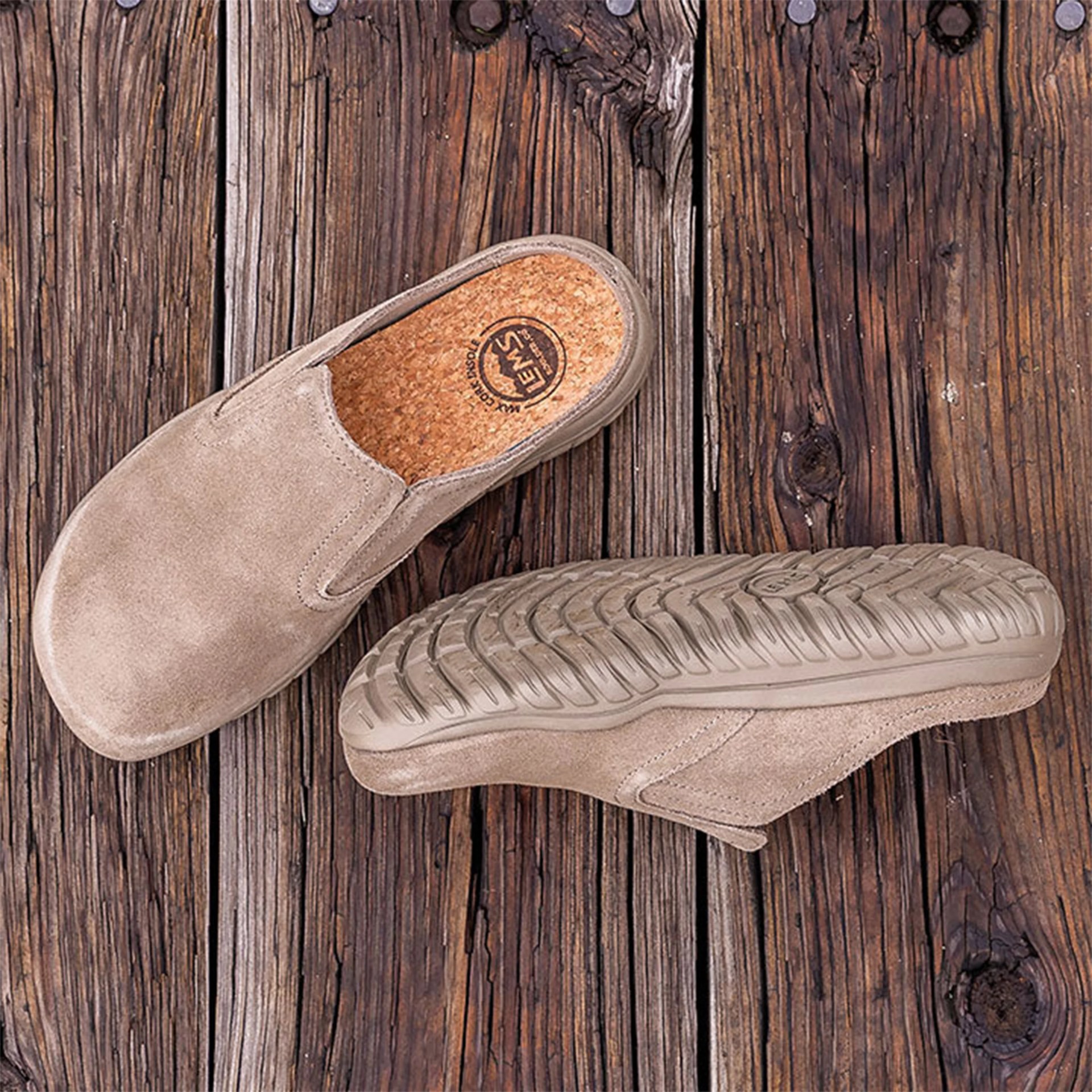 two clogs on a wooden deck