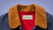 Close-up of an L.L.Bean jacket collar with brown corduroy and red lining.