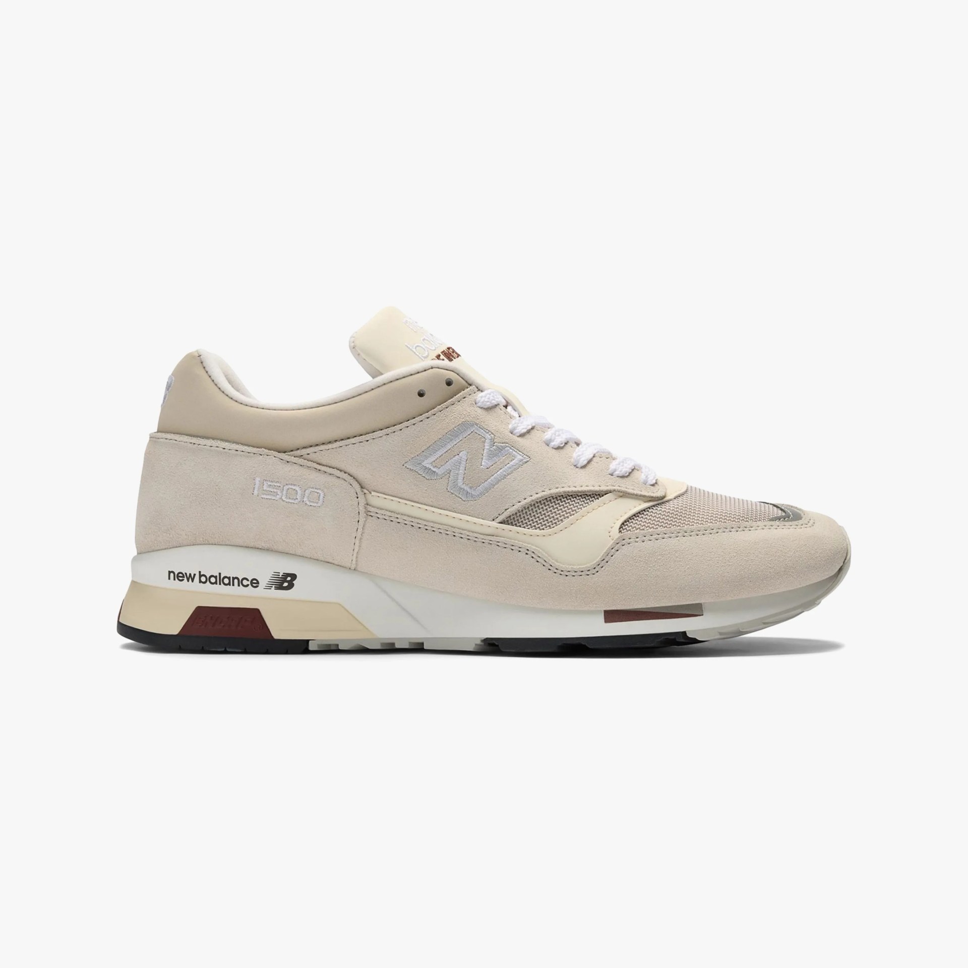 Beige New Balance 1500 sneaker with white laces and light gray logo on white background.