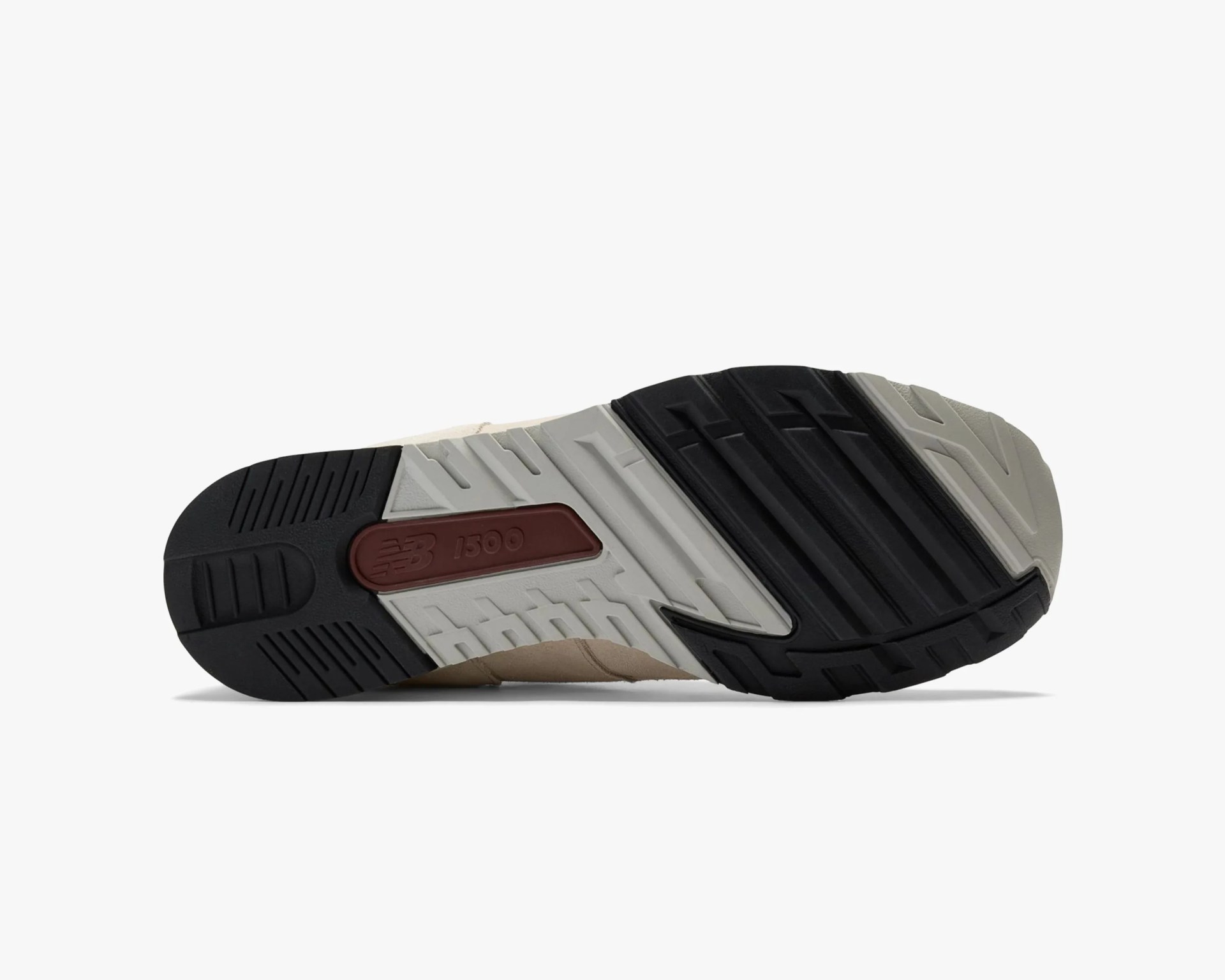 Sole of a New Balance 1300 sneaker with black, gray, and maroon rubber tread.