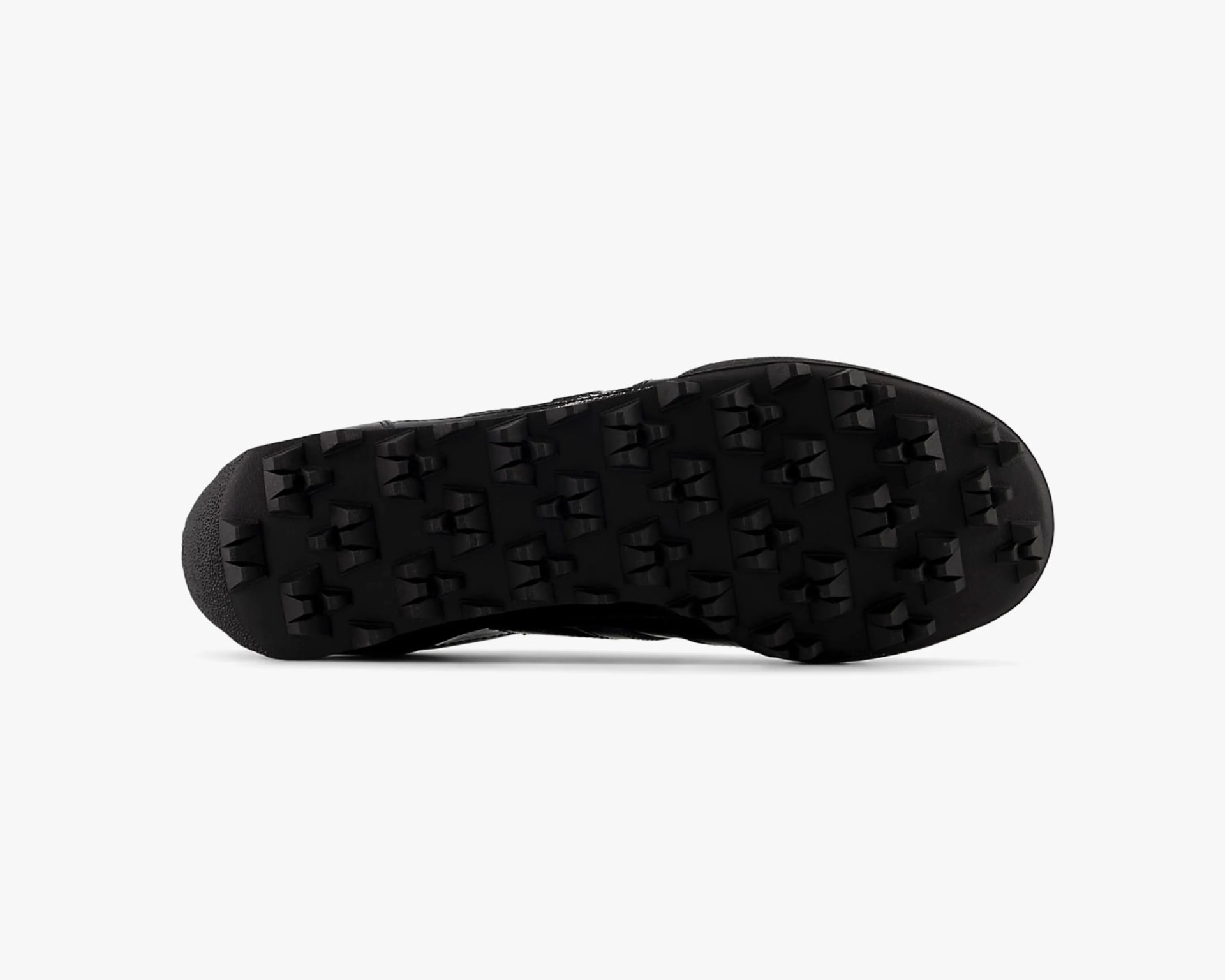 Black shoe sole with aggressive, multi-directional lugs for traction.