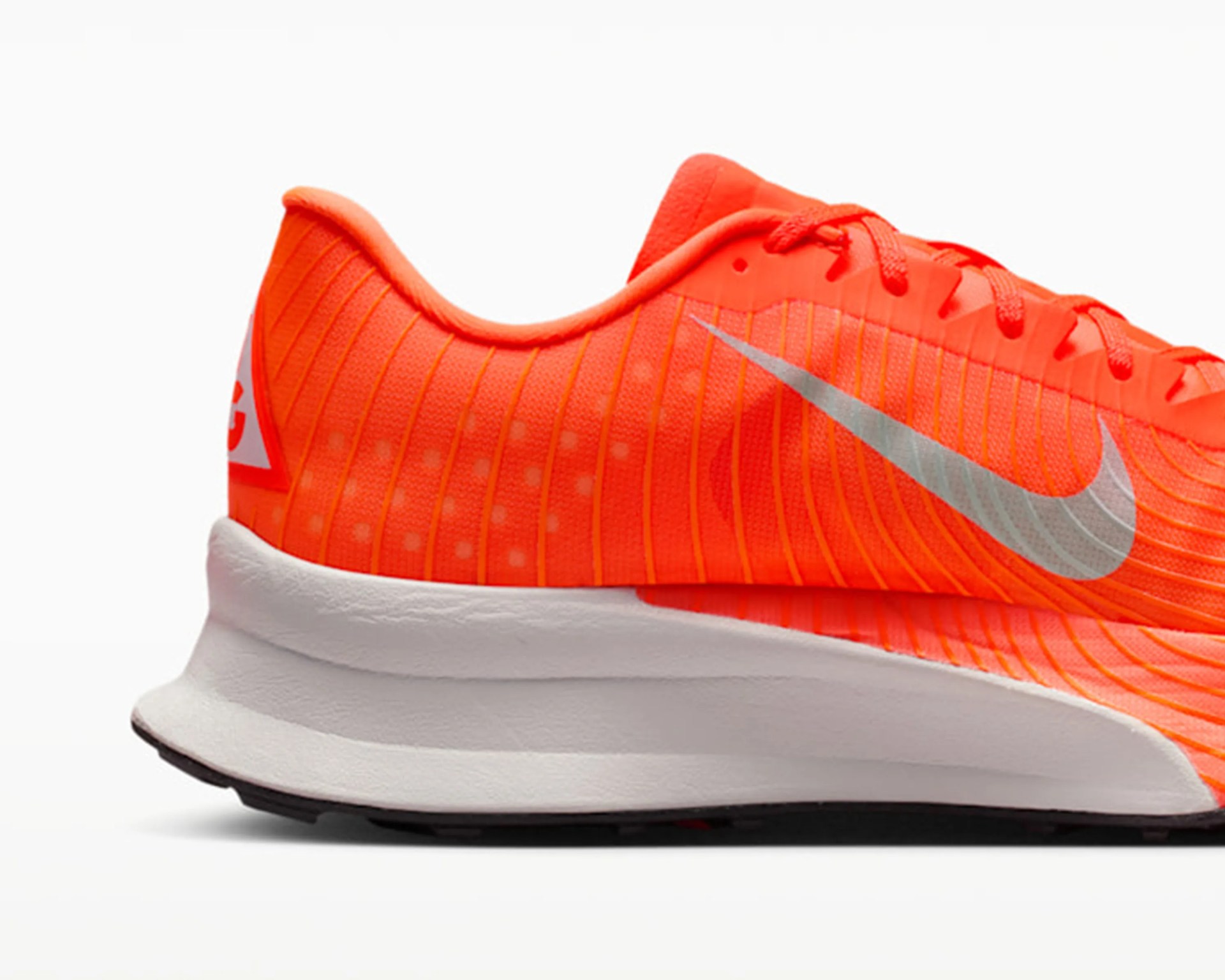 Bright orange Nike running shoe with silver swoosh and white cushioned sole.