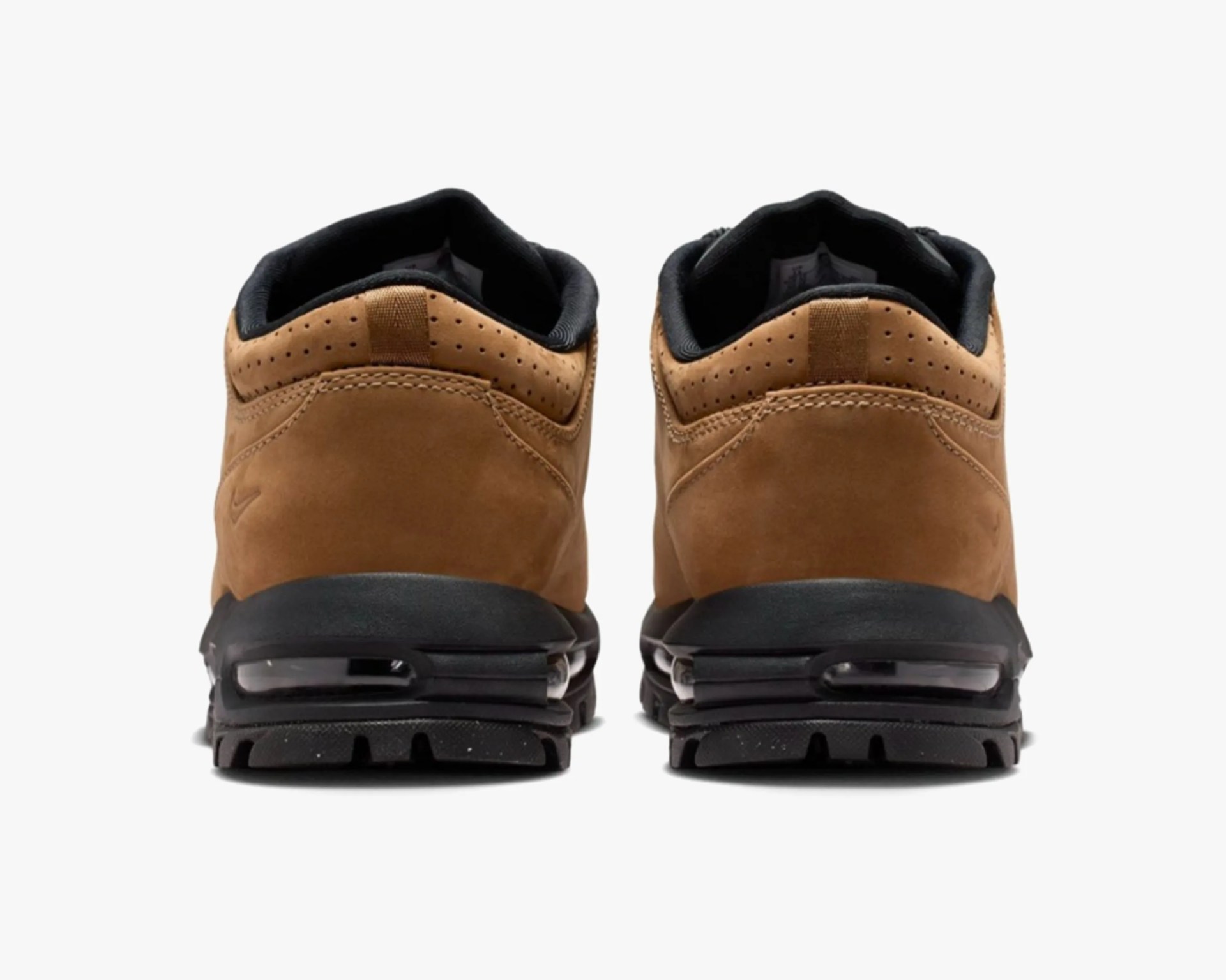 Pair of brown leather sneakers with black soles shown from the back.