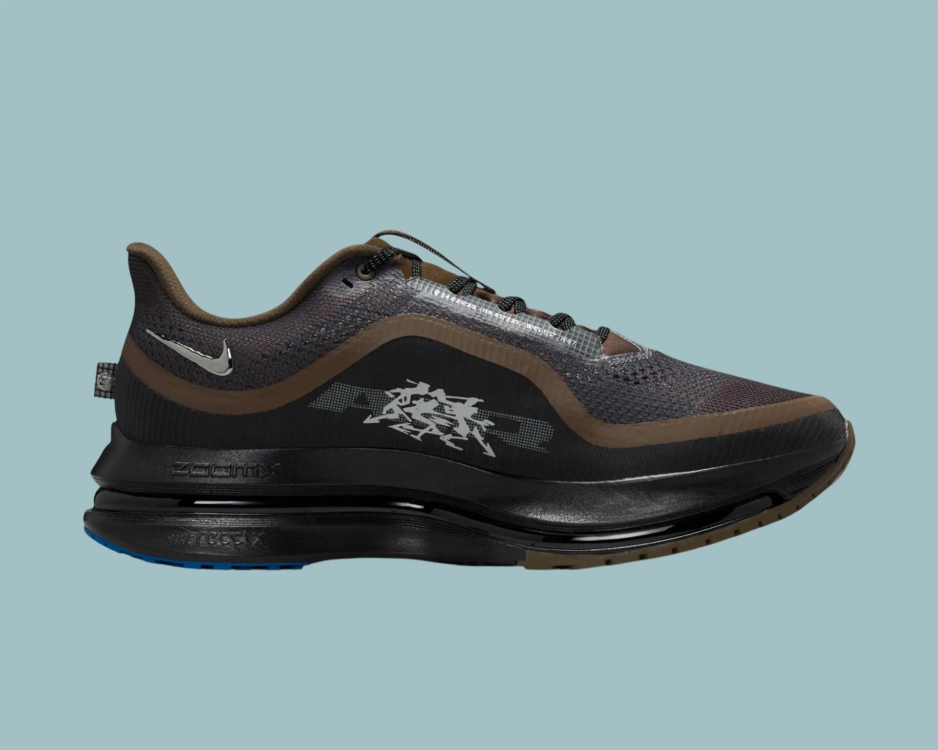 Black and brown Nike Air Zoom running shoe with reflective swoosh and graphic on side.