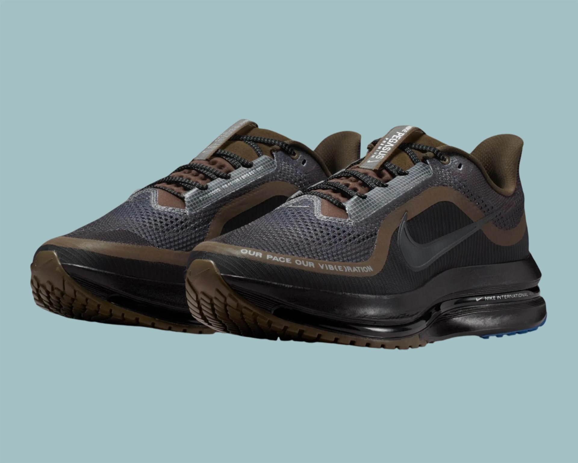 Pair of black and brown Nike Air Max running shoes with mesh upper and visible air sole units.