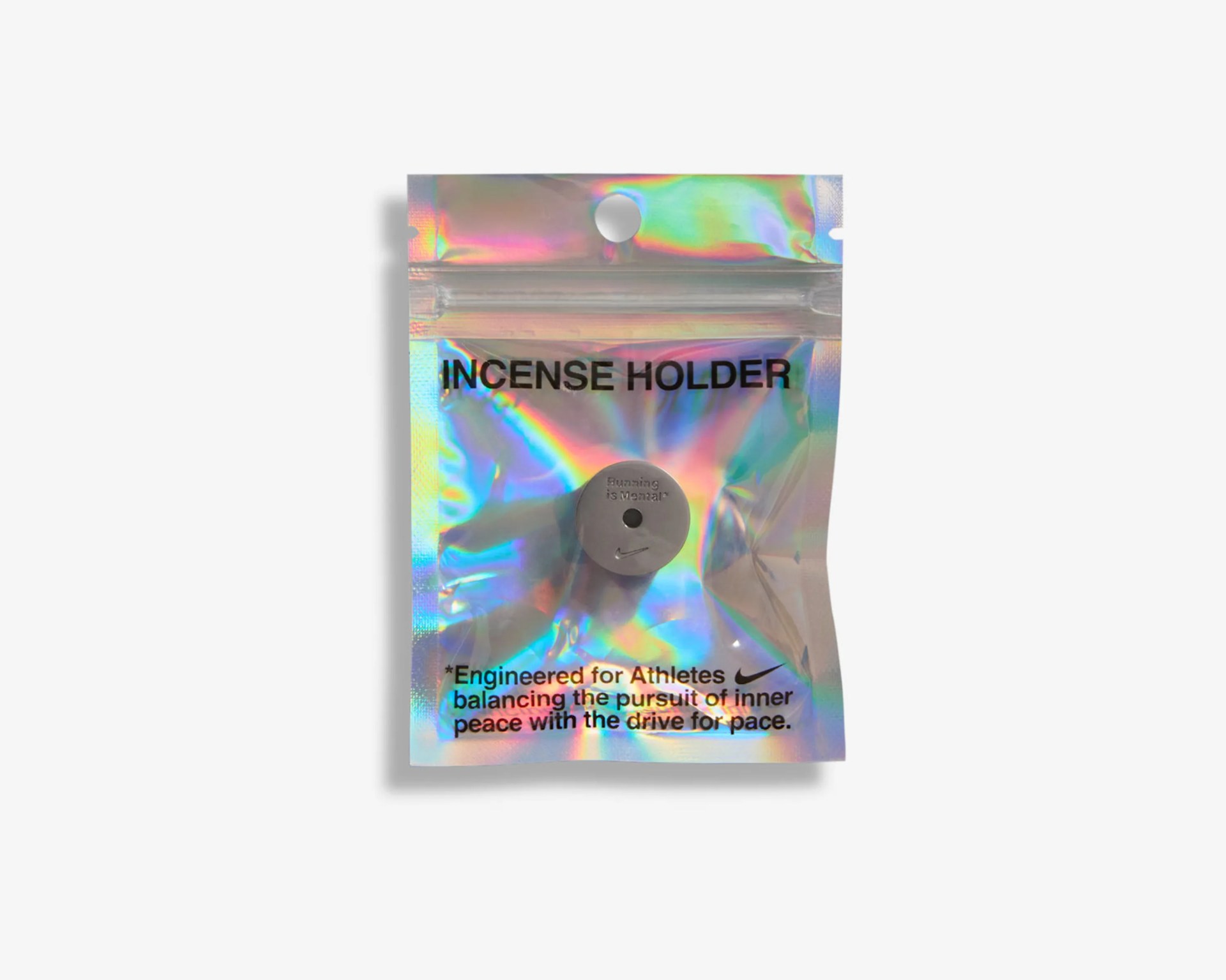 Small gray incense holder with "Running is Mental" and Nike logo, in a holographic resealable bag.